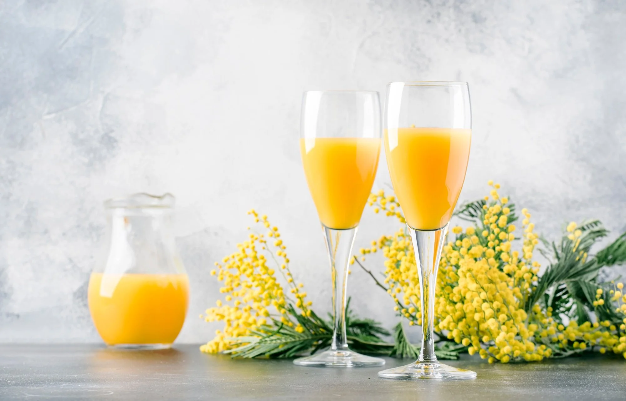 two glasses of orange mimosas