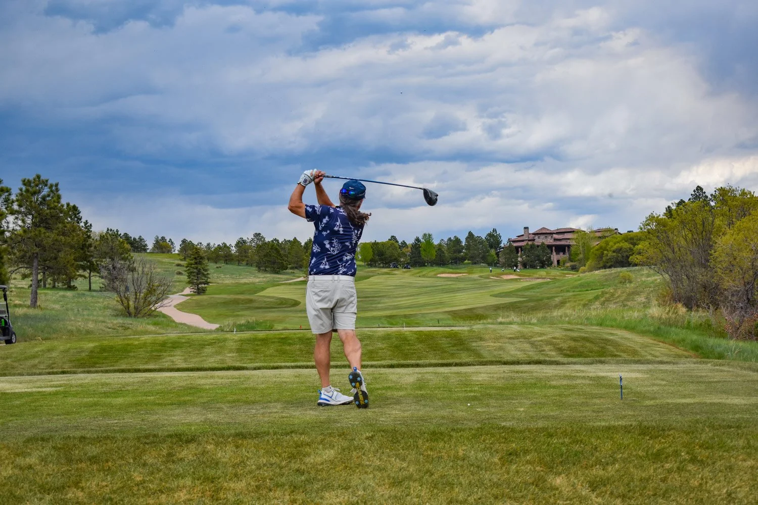 teeing off at weiskopf course