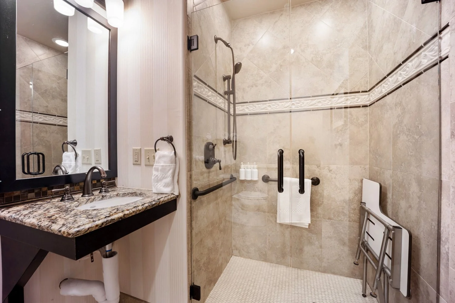 ADA compliant bathroom accommodations in double queen room