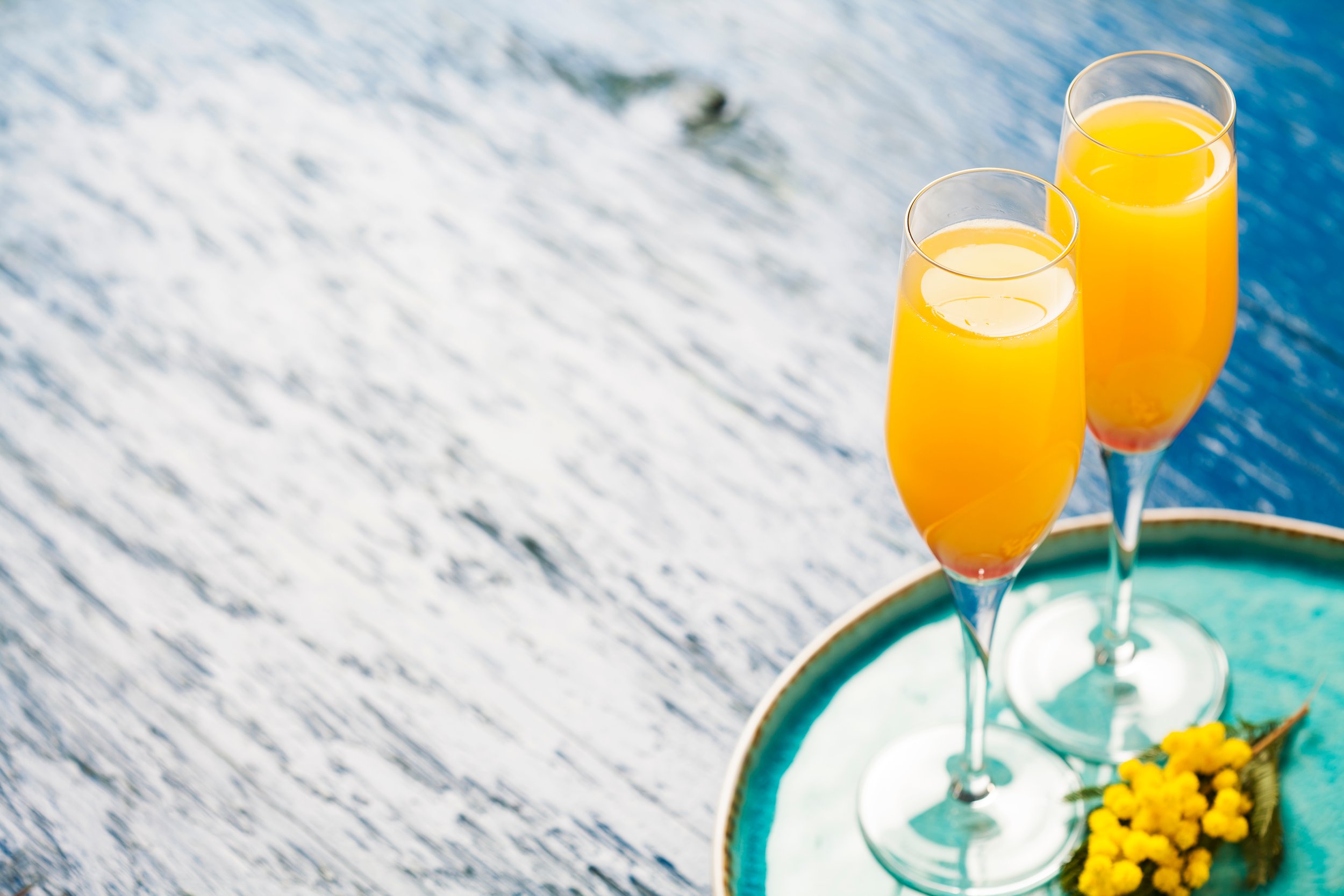 two glasses of orange mimosas