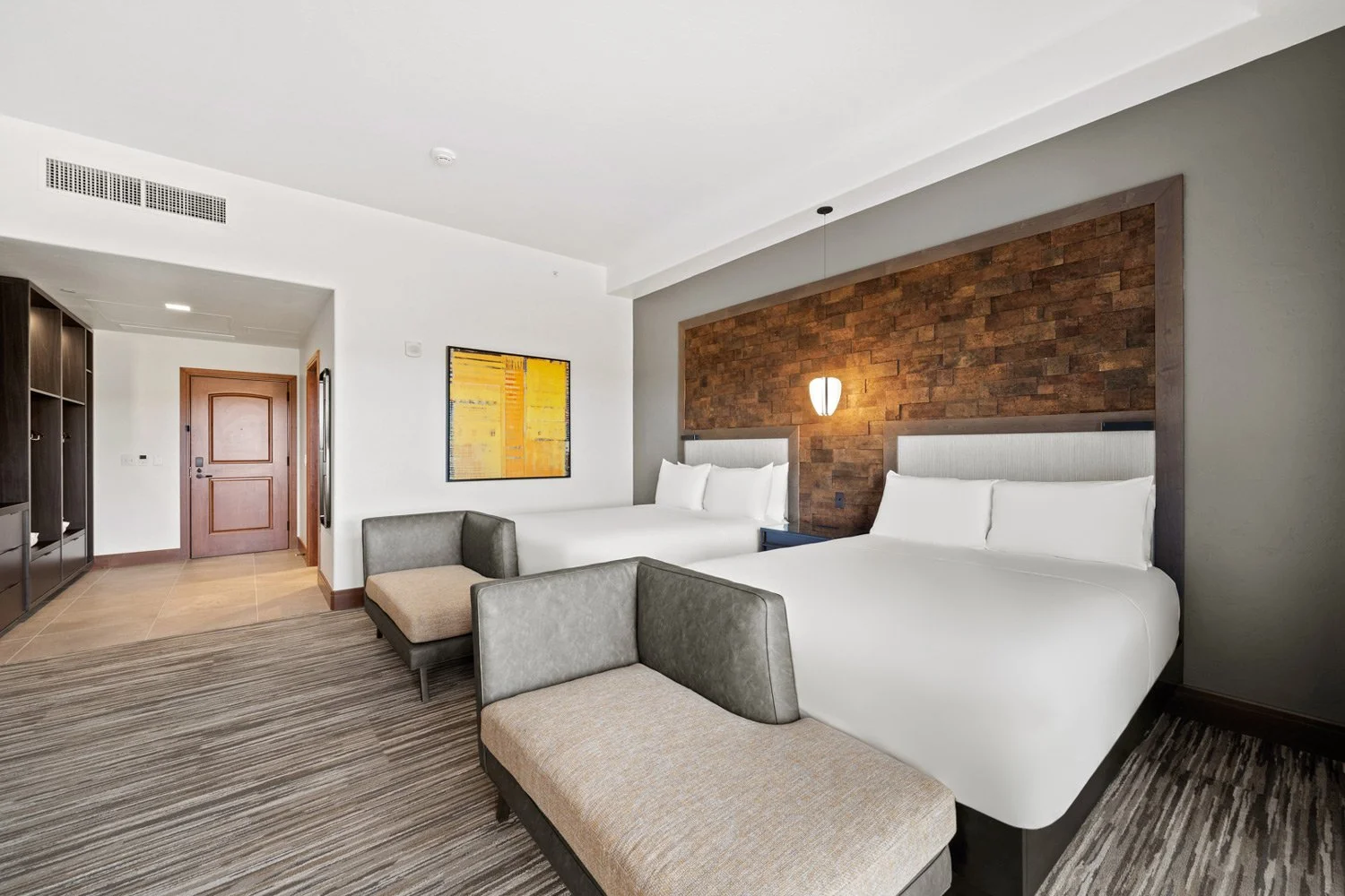 queen guest room with two couches