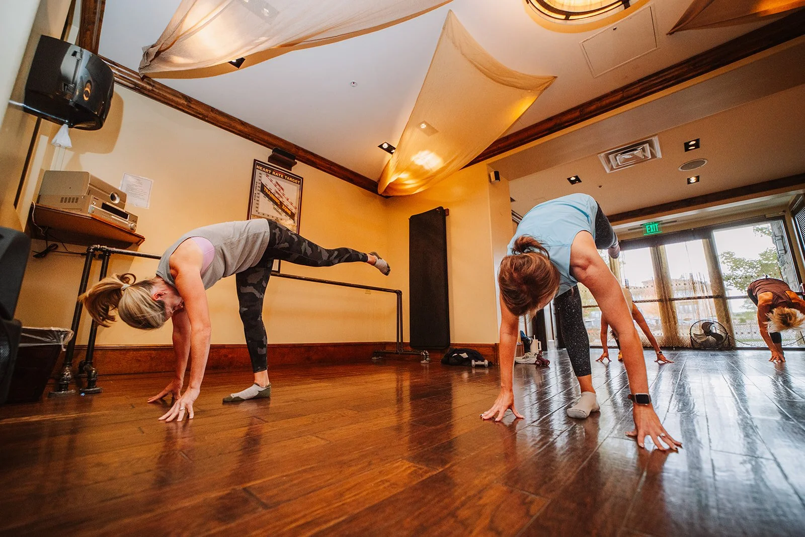 pilates class exercising at the club