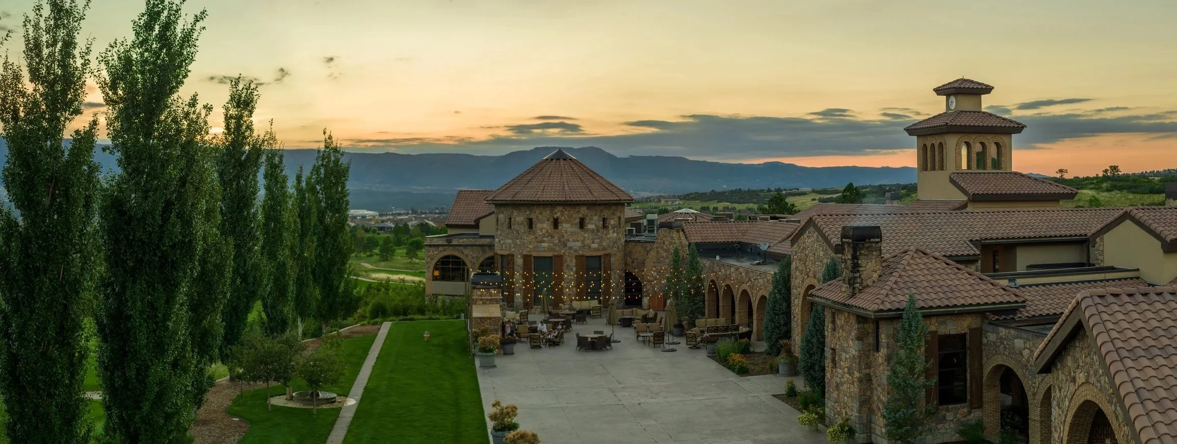 courtyard patio at sunset with bistro lights