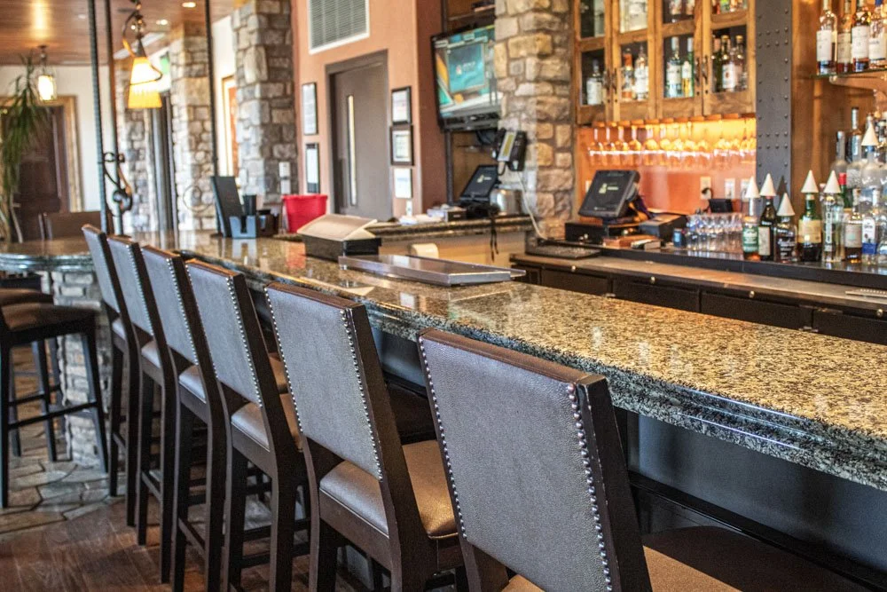 tack room bar seating with granite counter