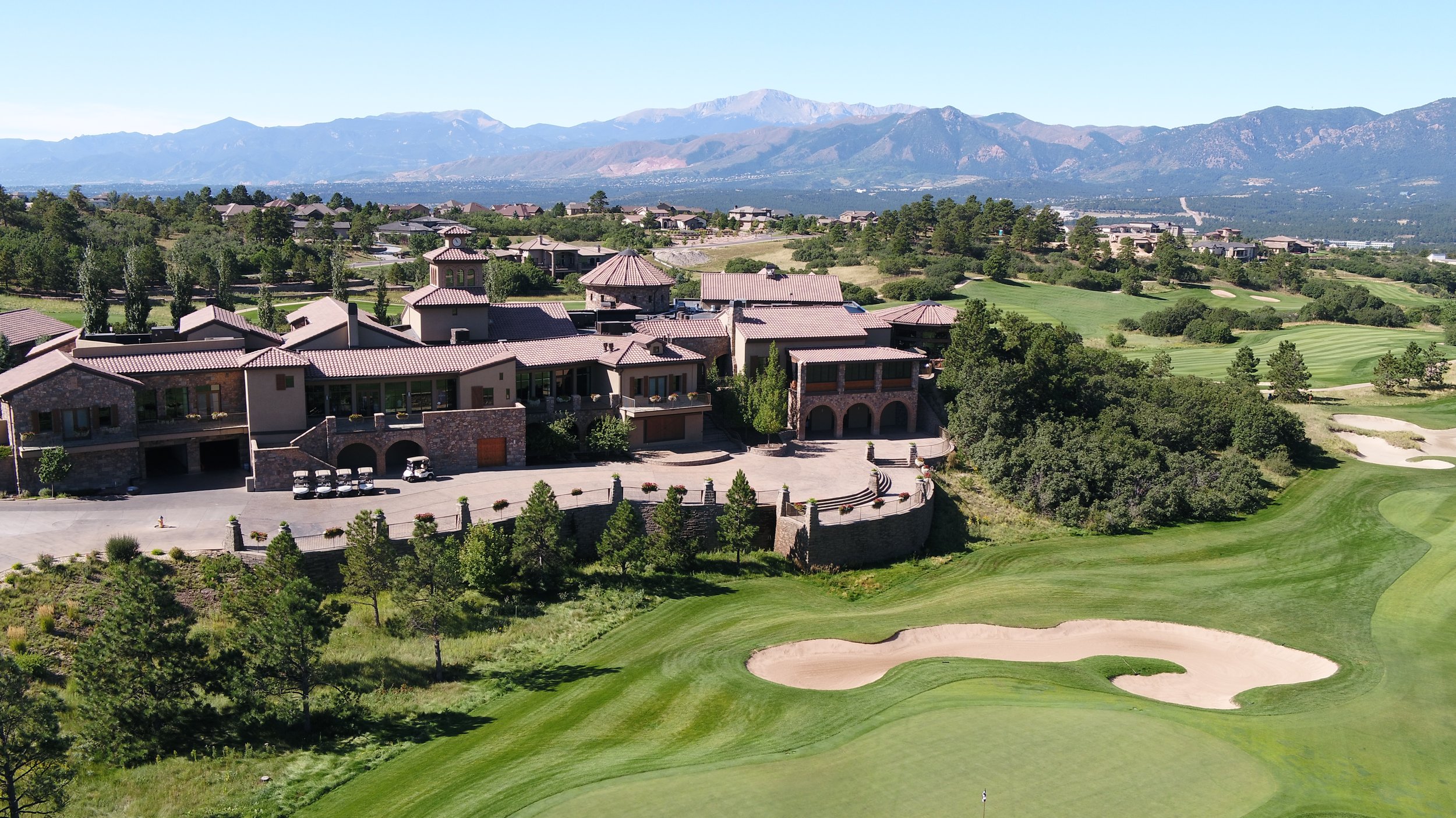 weiskopf golf course and clubhouse aerial image with mountains