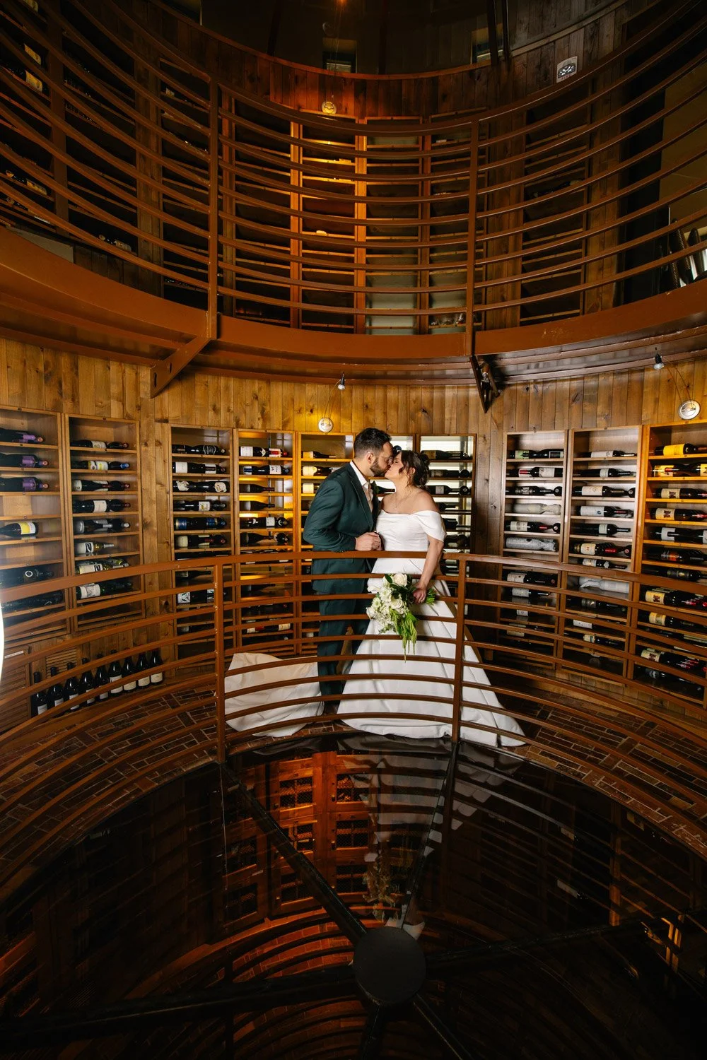 bride and groom inside the wine tower