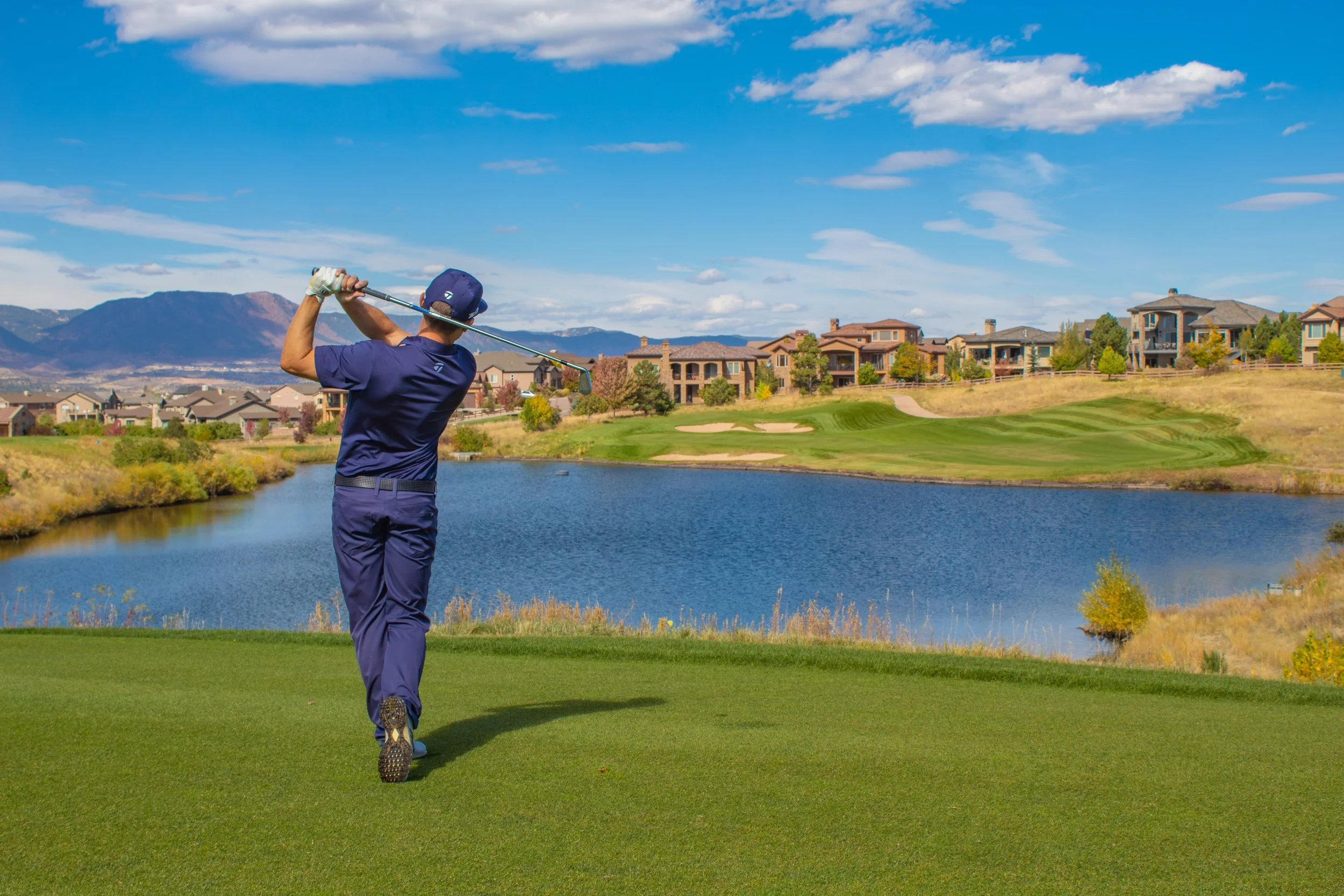 Flying Horse Golf Academy student golfing over pond
