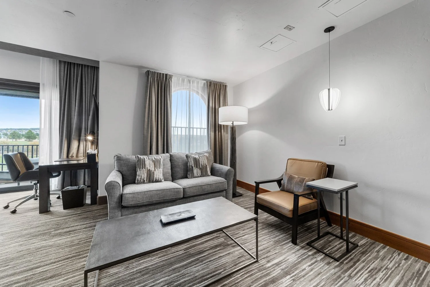 luxury seating and pull-out couch in the academy suite