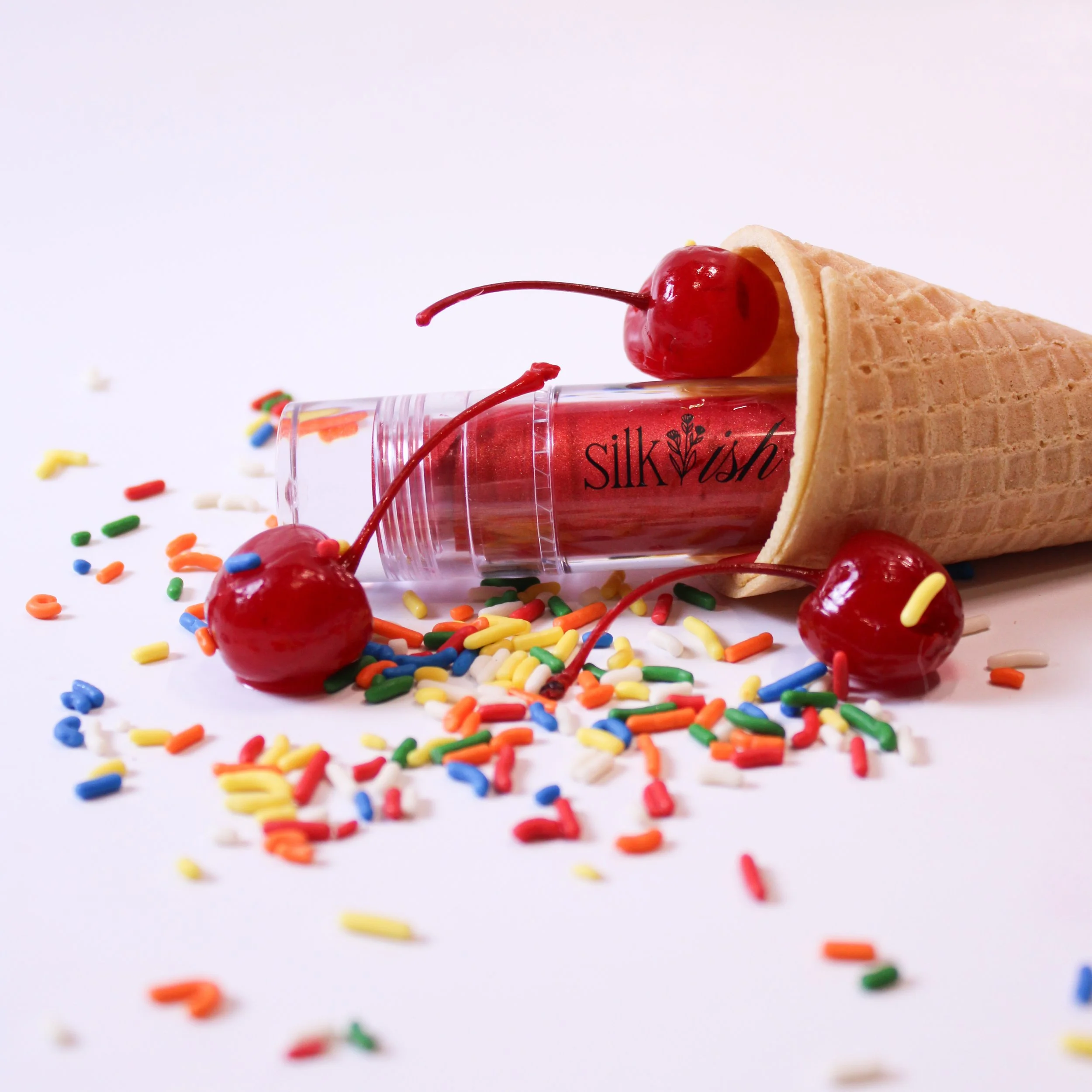 Red Eyeshadow in ice cream cone with cherries and sprinklies