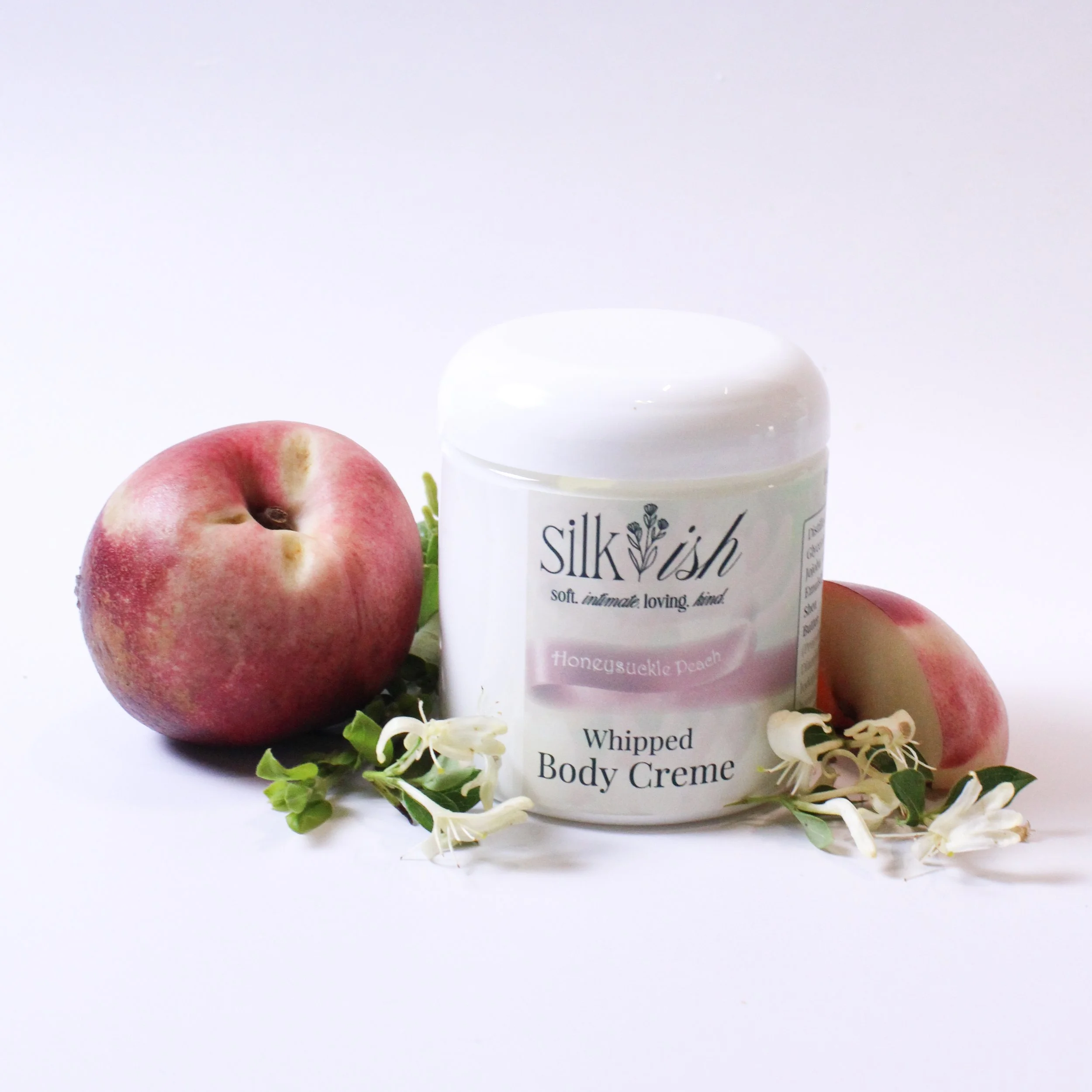 Body cream with peaches and honeysuckle