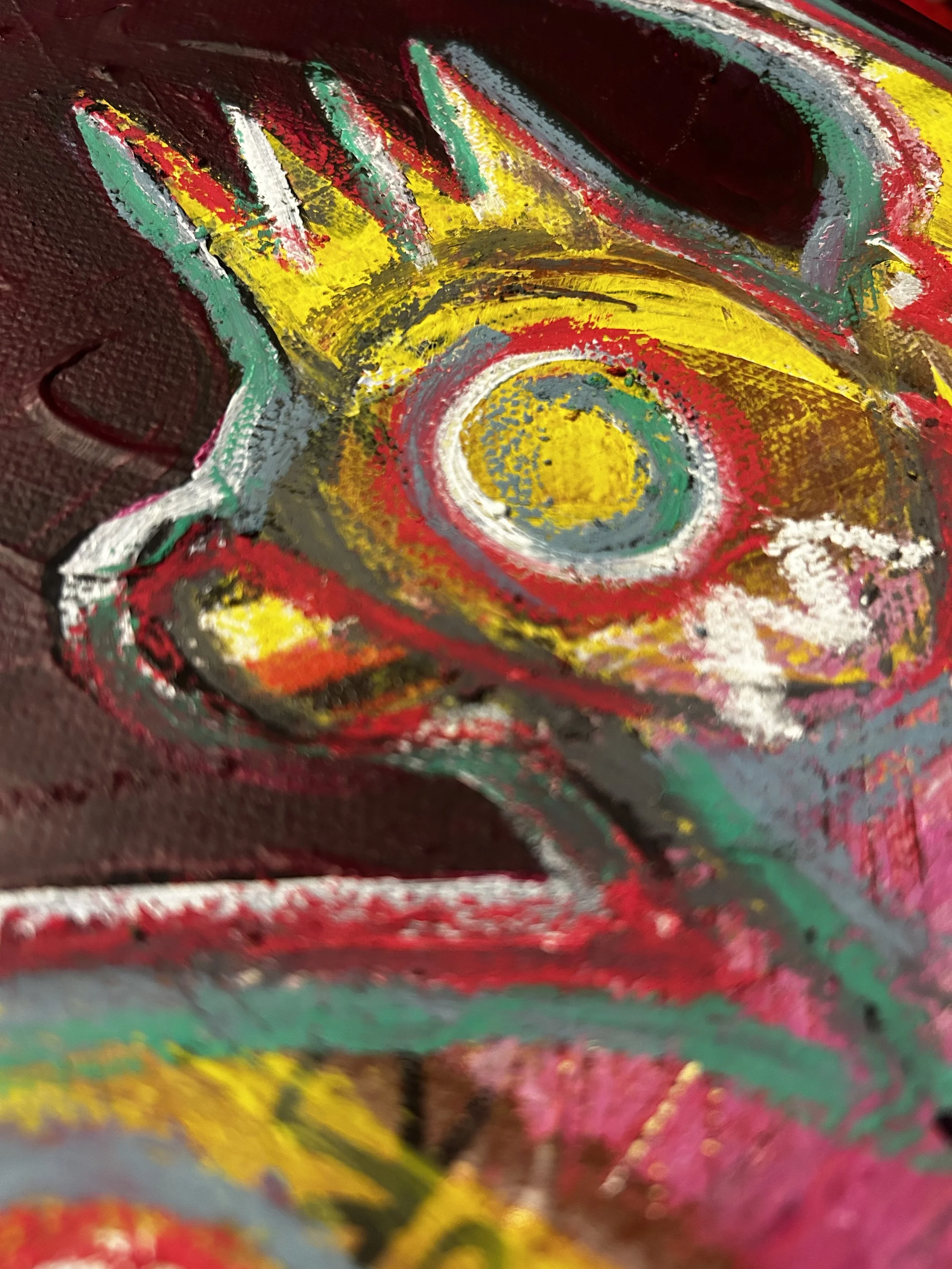 Close-up of an abstract, colorful painting with a swirling pattern, using red, yellow, green, white, and black paint.