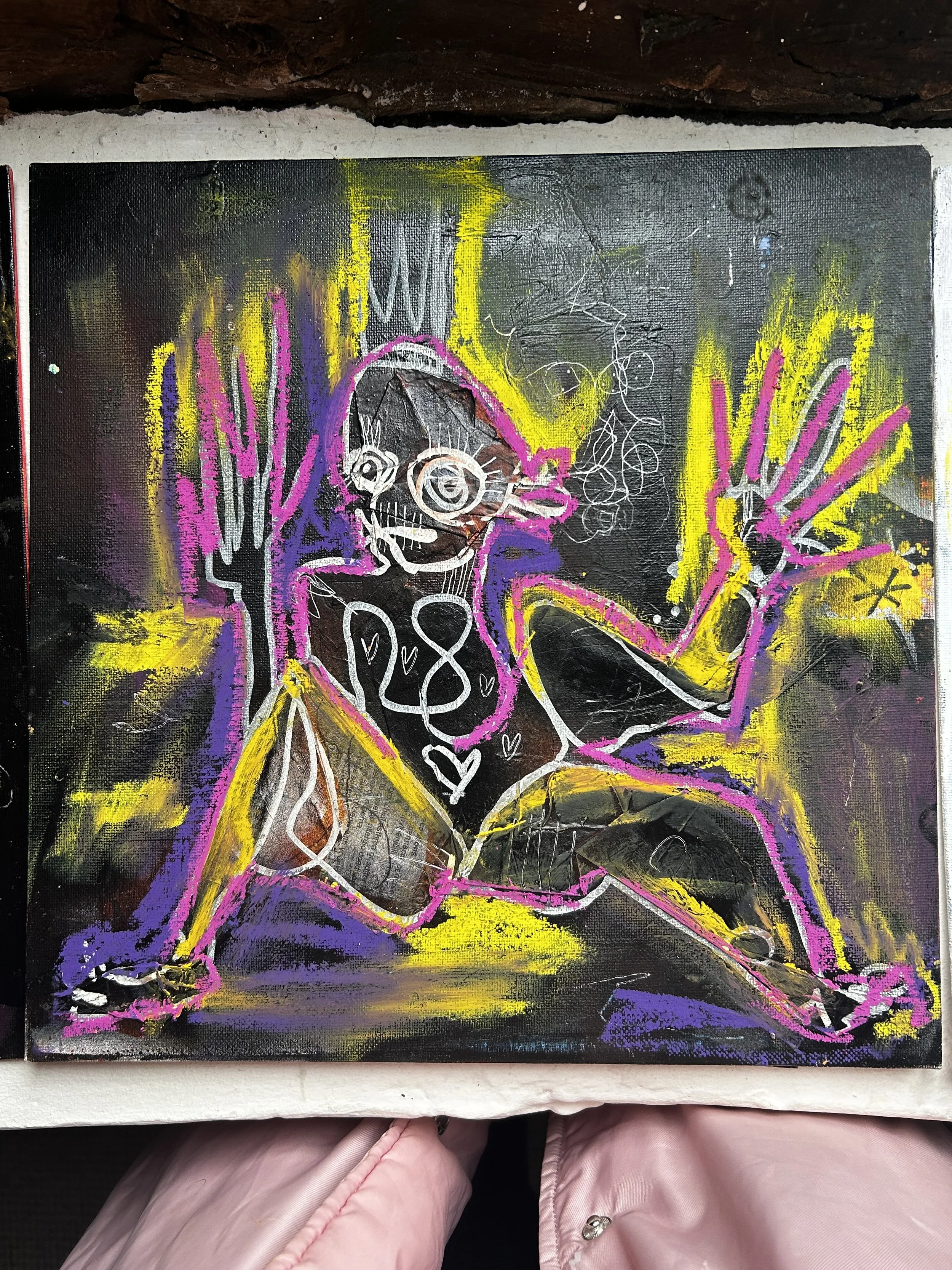 Colorful abstract artwork featuring a female figure outlined in white, with pink, purple, yellow, and black background, and various scribbled details.