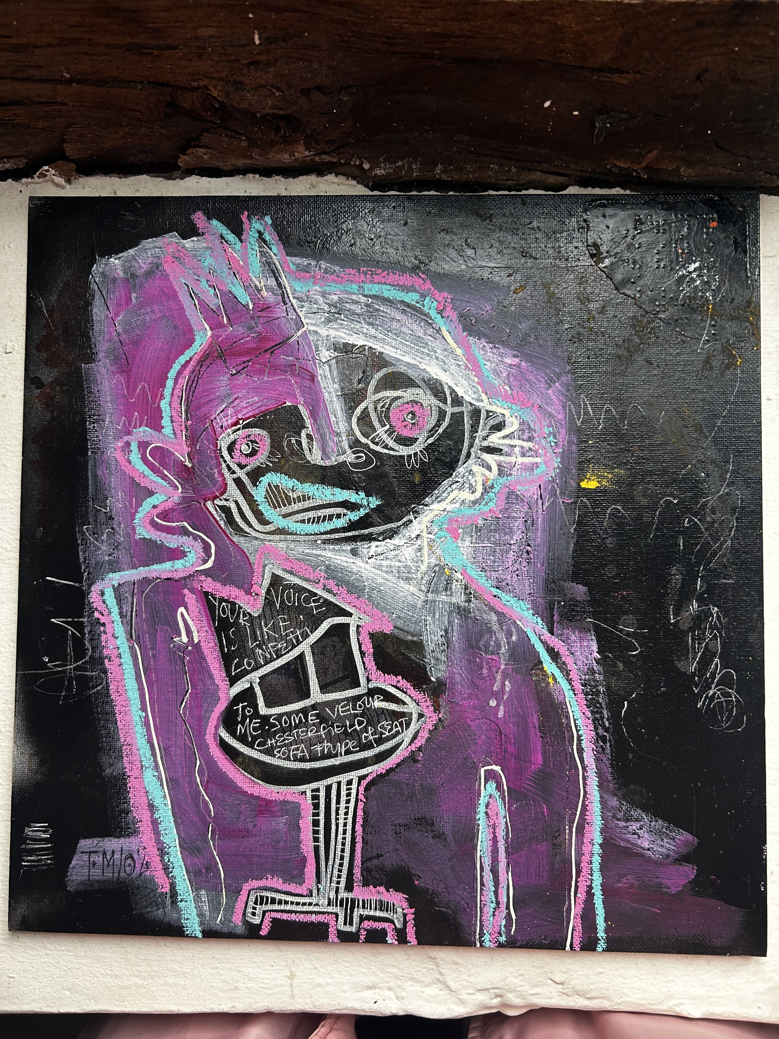 Colorful abstract graffiti-style portrait of a woman with pink hair, expressive eyes, and a speech bubble listing furniture items, set against a dark, textured background.