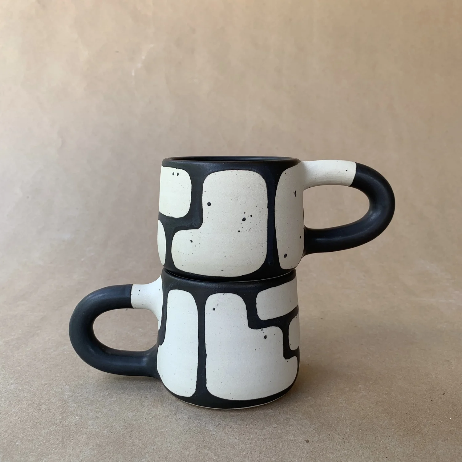 Chunk Mug, black and white hand-thrown mug with an abstract block pattern
