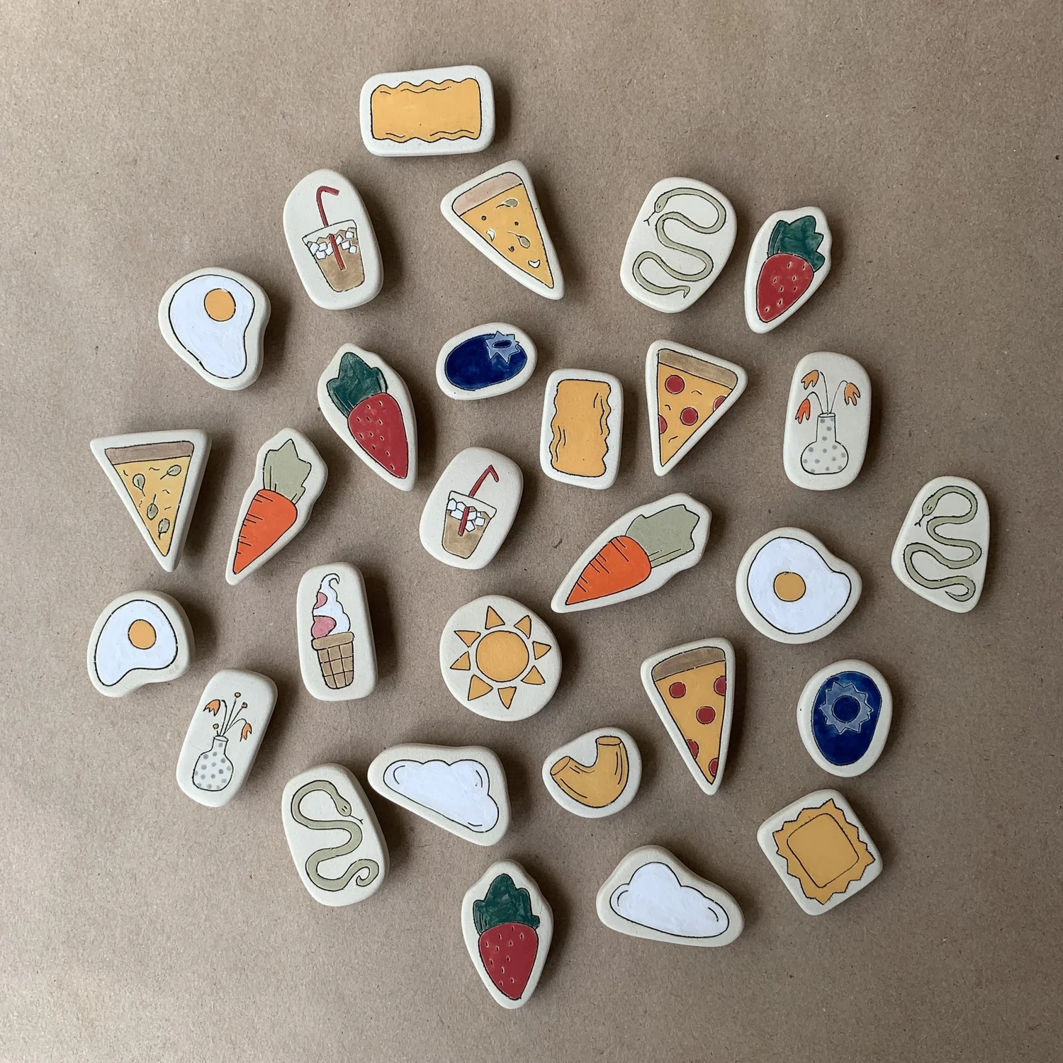 Hand-painted ceramic magnets including pizza, eggs and fruit