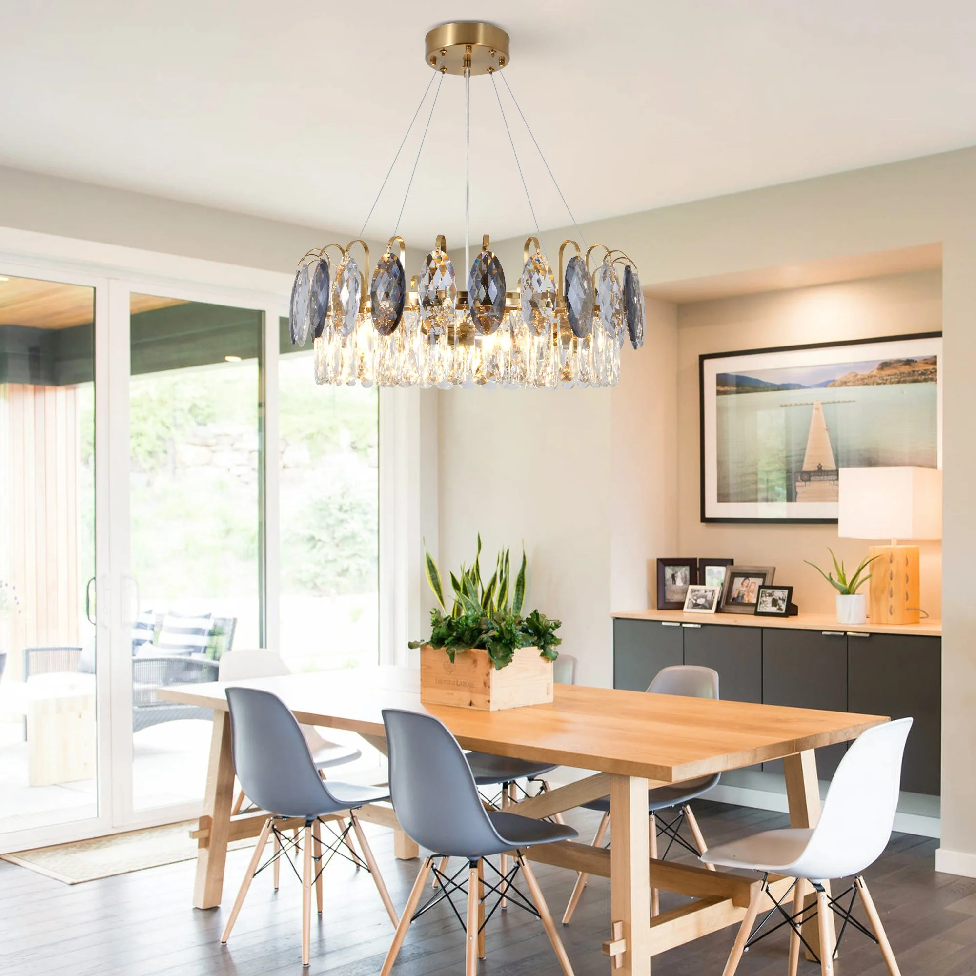 antique brass crystal chandelier above modern dining table
