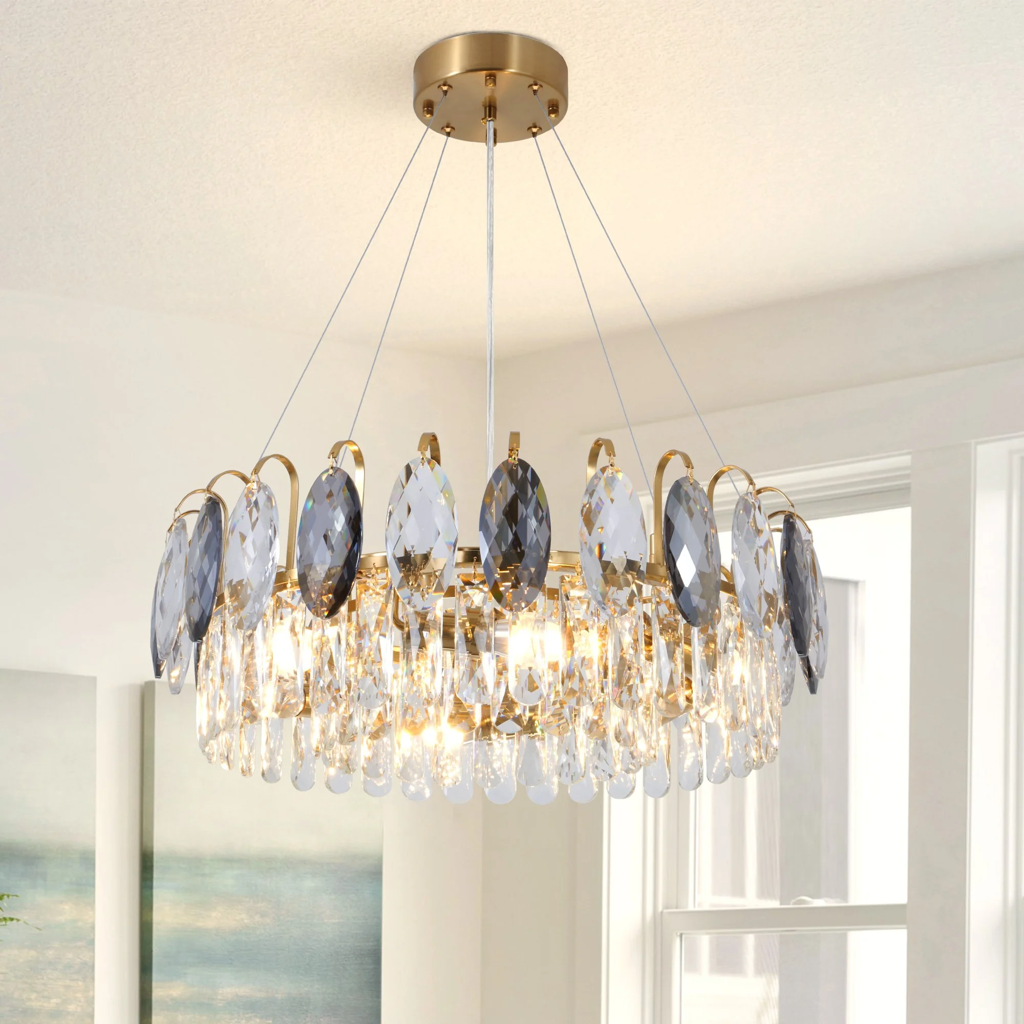 24-inch antique brass crystal chandelier with clear and smoke gray crystals in bright interior