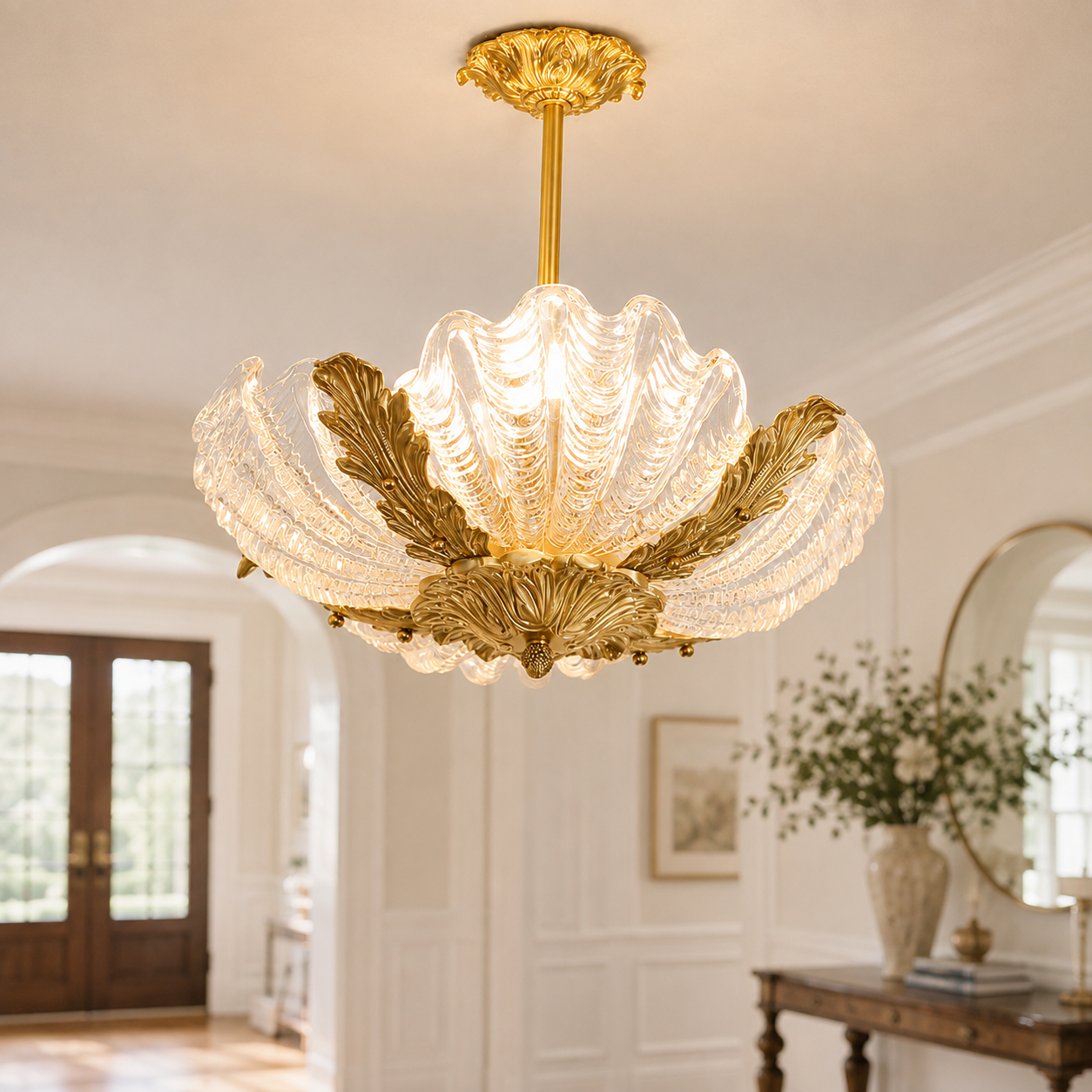 French shell glass chandelier DS-DG01 illuminating an elegant entryway with clear glass shades and brass accents