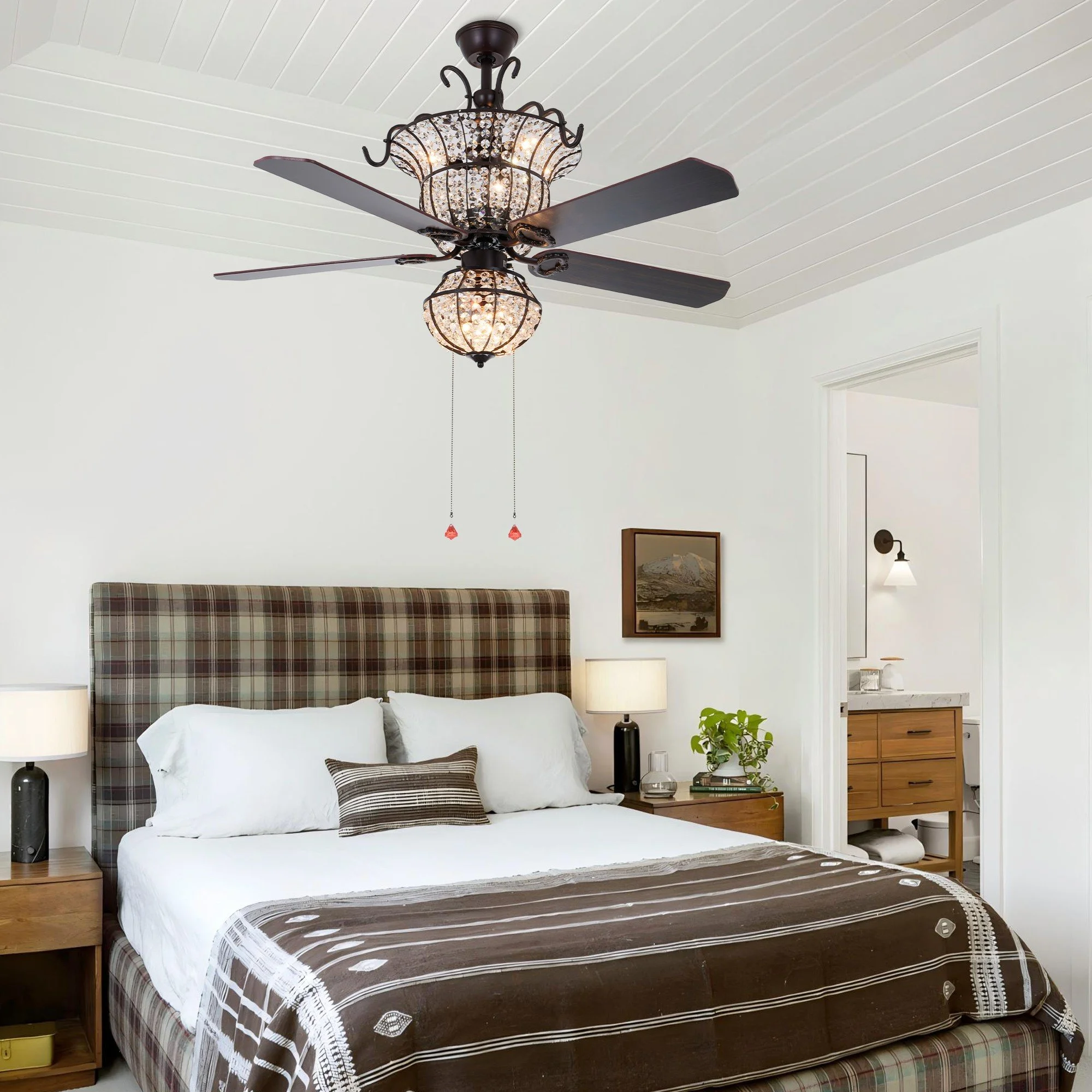 Farmhouse crystal ceiling fan with dark wood blades and warm chandelier lighting in a traditional bedroom