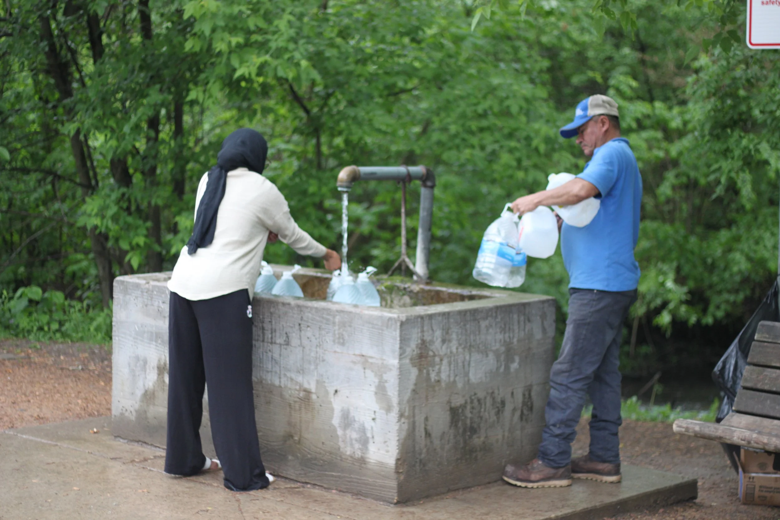 People filling up by the gallon at the Frederick-Miller Spring.
