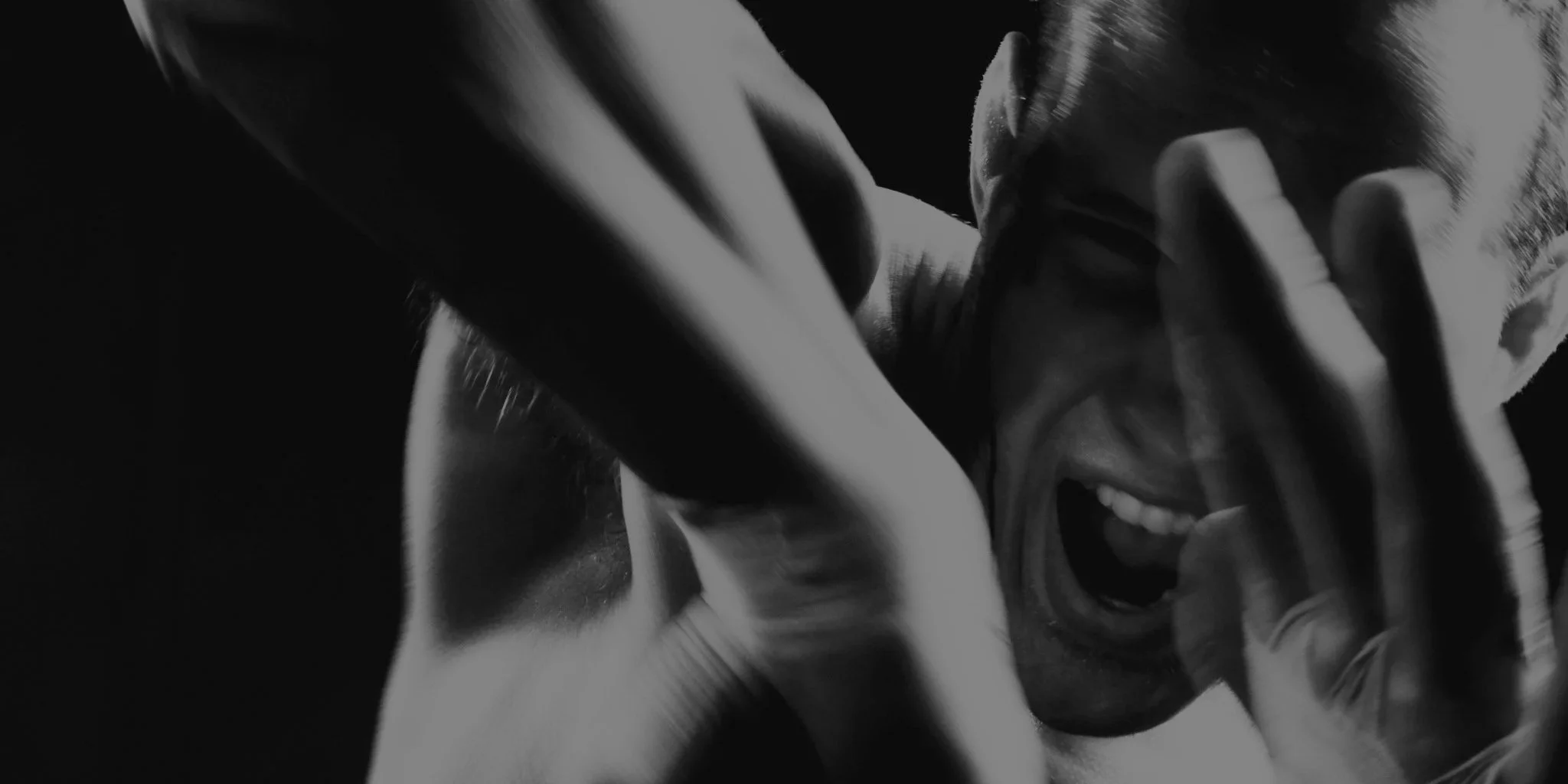 A muay thai fighter throwing an elbow towards the camera