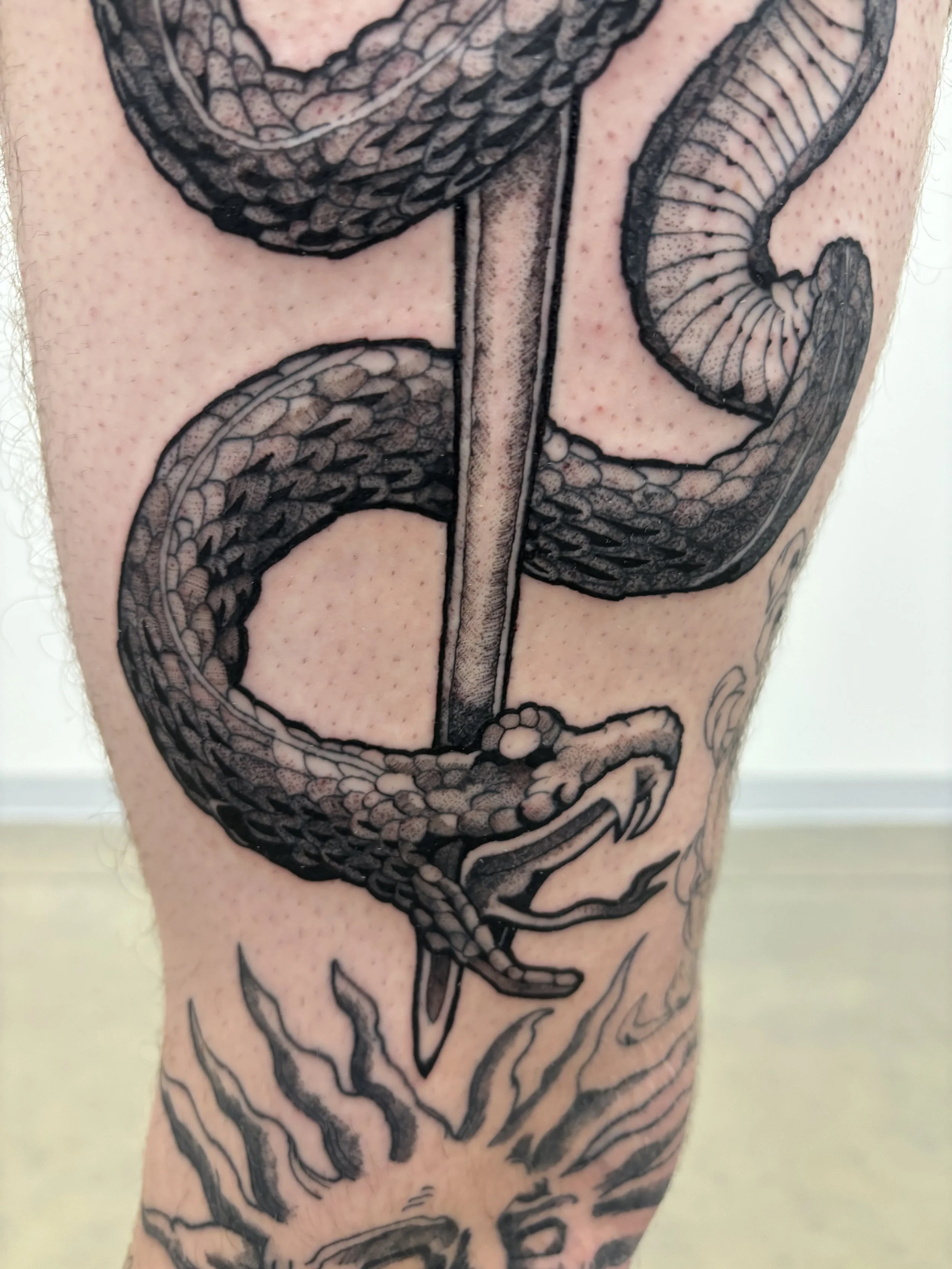 snake and sword tattoo 