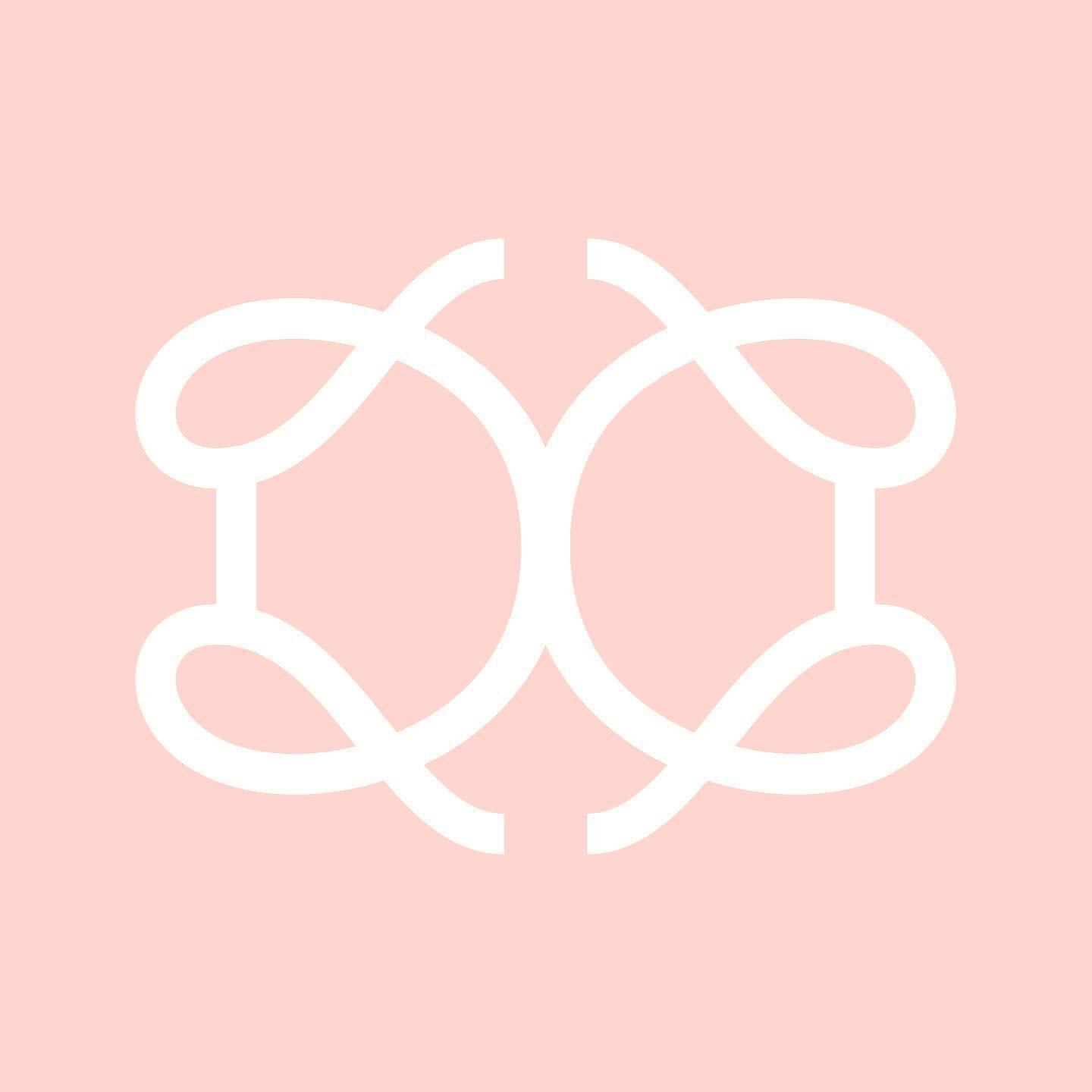 A white abstract geometric pattern on a light pink background.