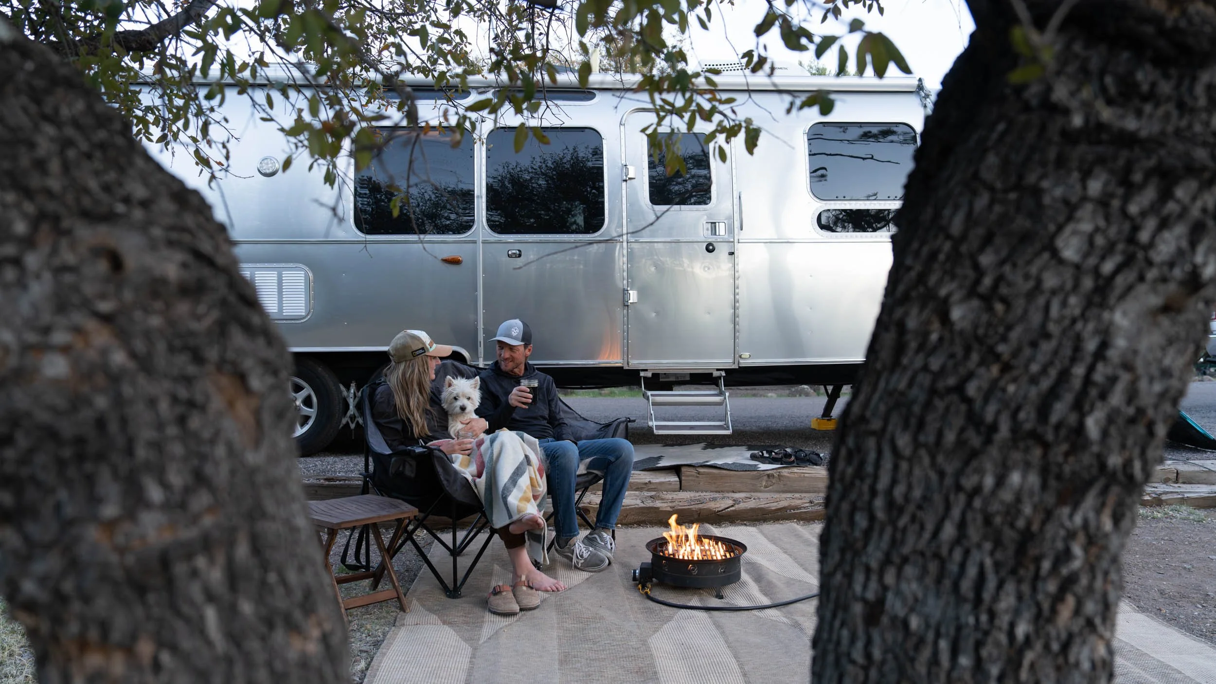 couple-dog-propane-fire-airstream-rv-camping.JPG