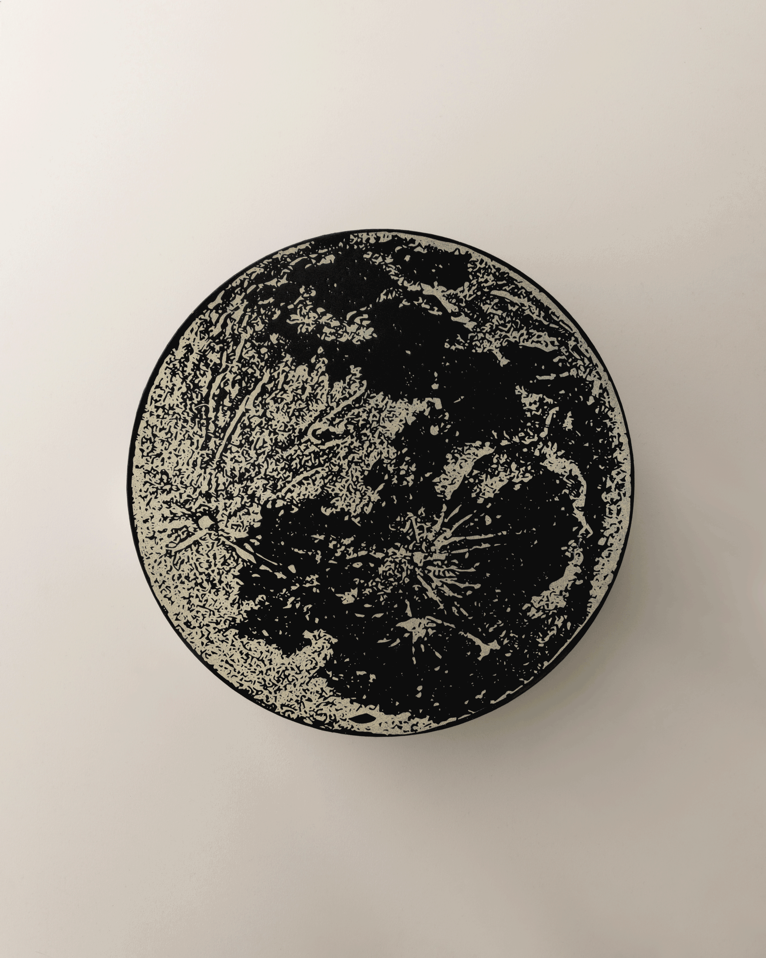 Black and beige abstract circular artwork on a white background