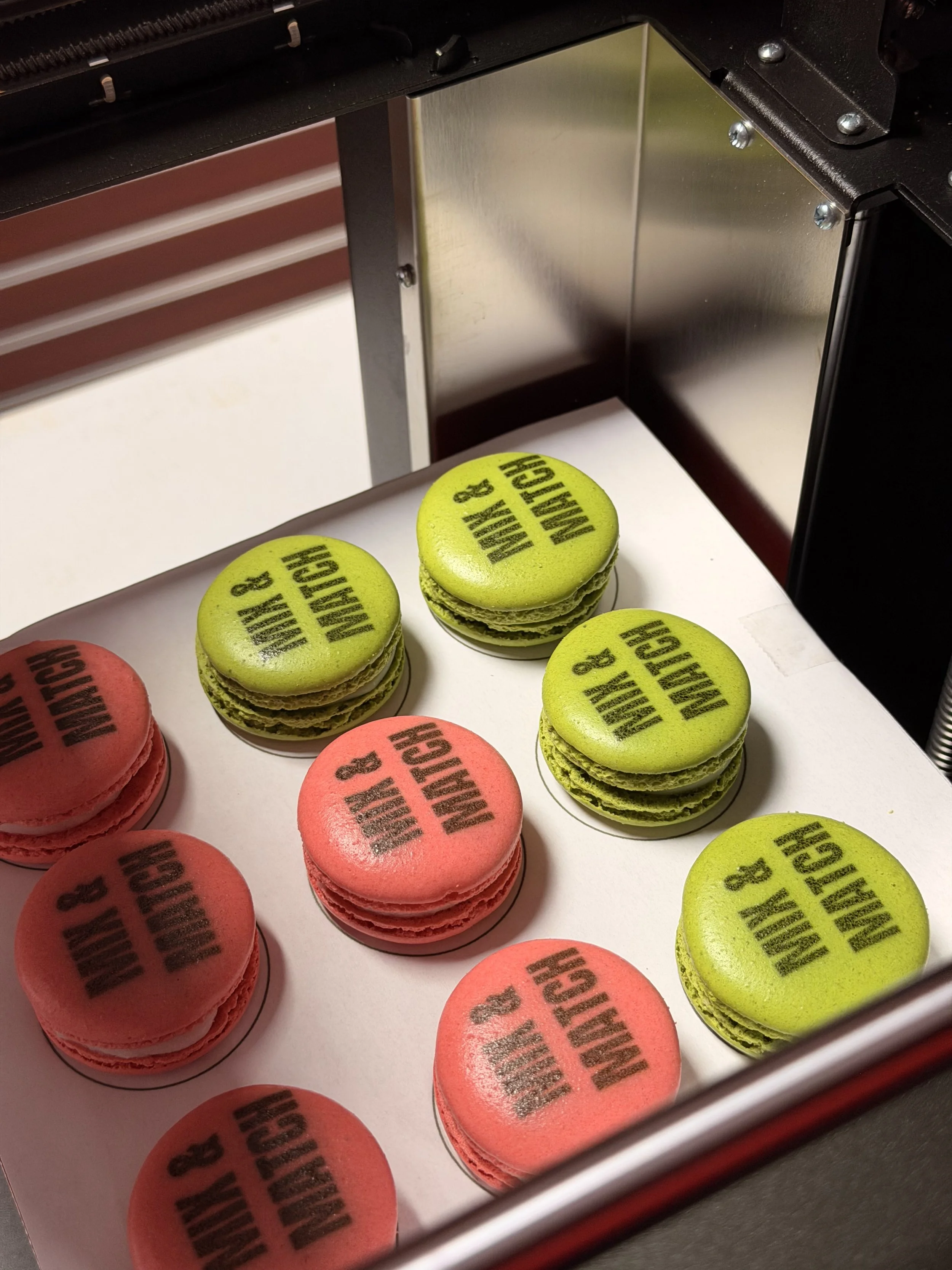 macarons with custom logo inside of the food printer