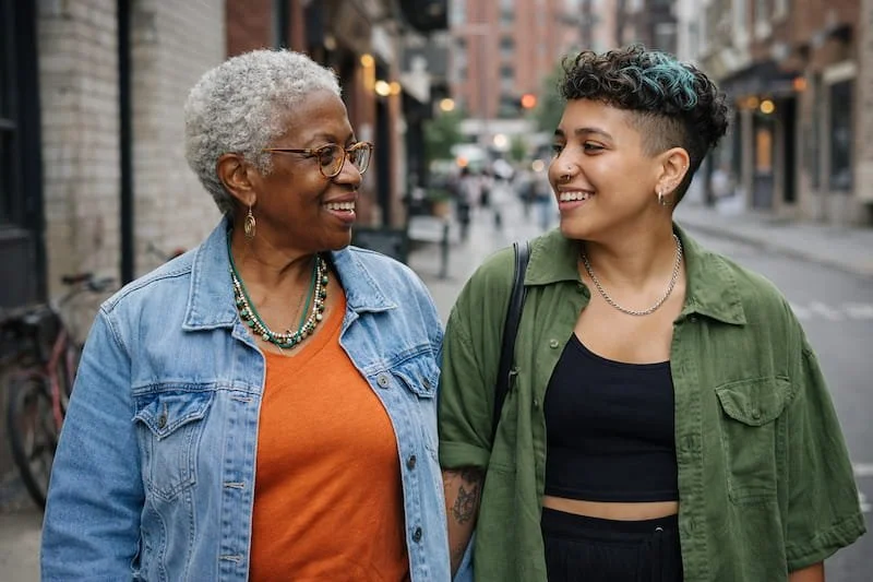 an older and younger woman walking together