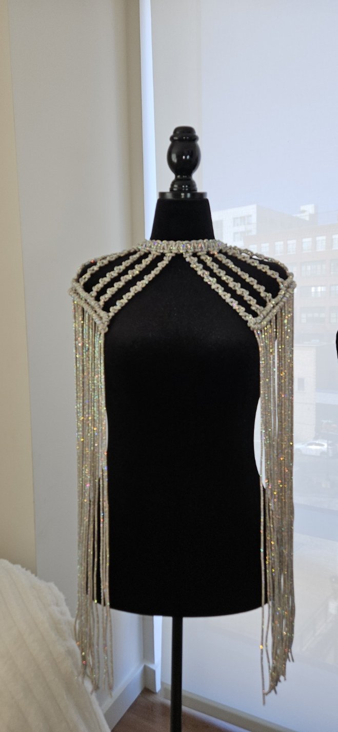 Macramé fringe choker displayed on a mannequin in a studio