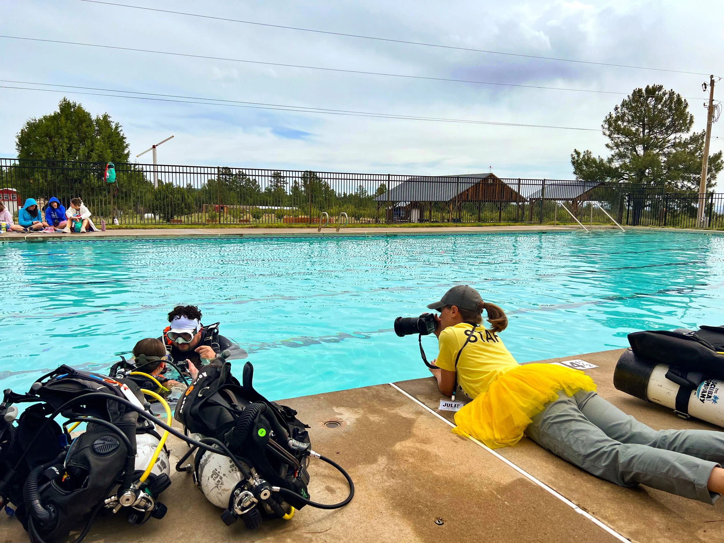 Camp Enchantment Board member in action photographing activities at camp