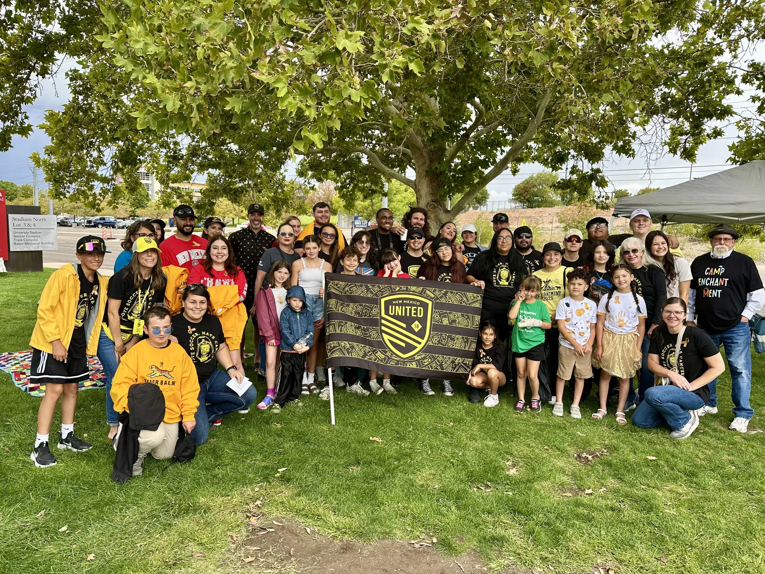 Camp Enchantment group at the United match - Love Soccer Hate Cancer pediatric cancer night organized by the Camp Enchantment Board of Directors