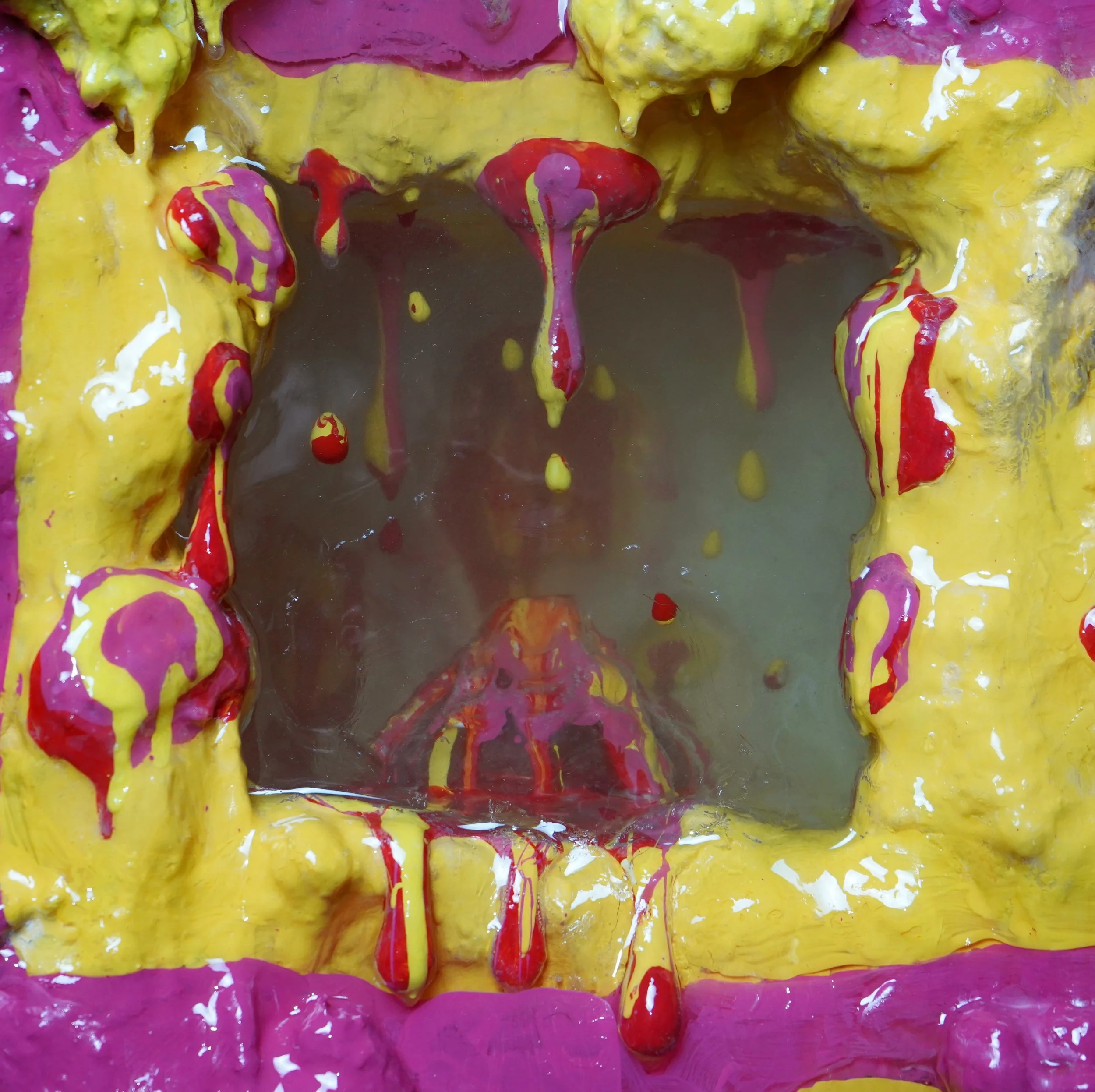 Detail view of Volcanic Shelf sculpture by contemporary artist Sophia Huang, mixed media shelf sculpture with resin, paint, and embedded objects, abstract melting form