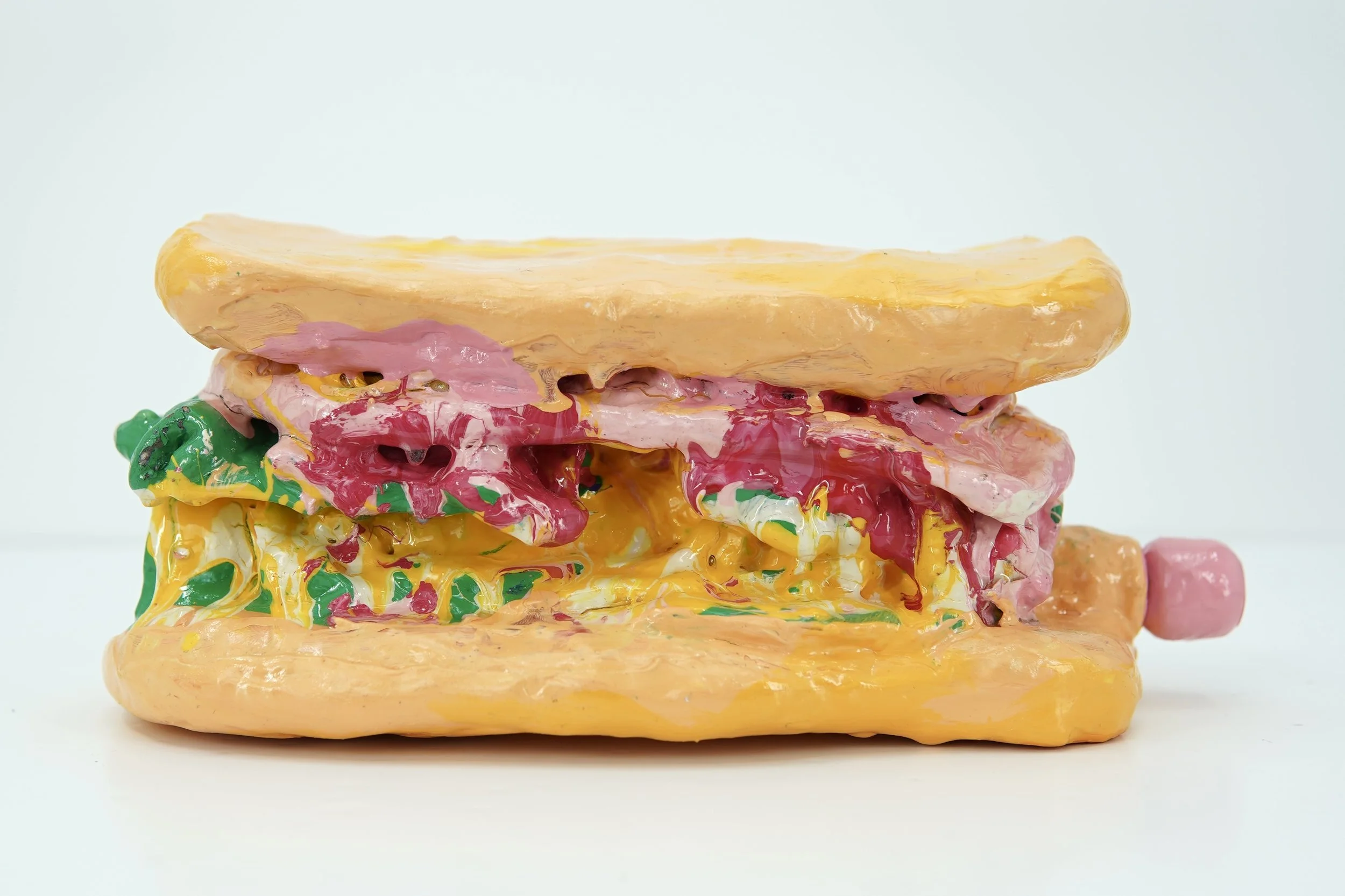 In Ash Banquet, artist Sophia Huang creates abstract resin and clay foam vessels containing the ashes of burned letters to past lovers and former selves, transforming grief into a ritual of containment, closure, and release.