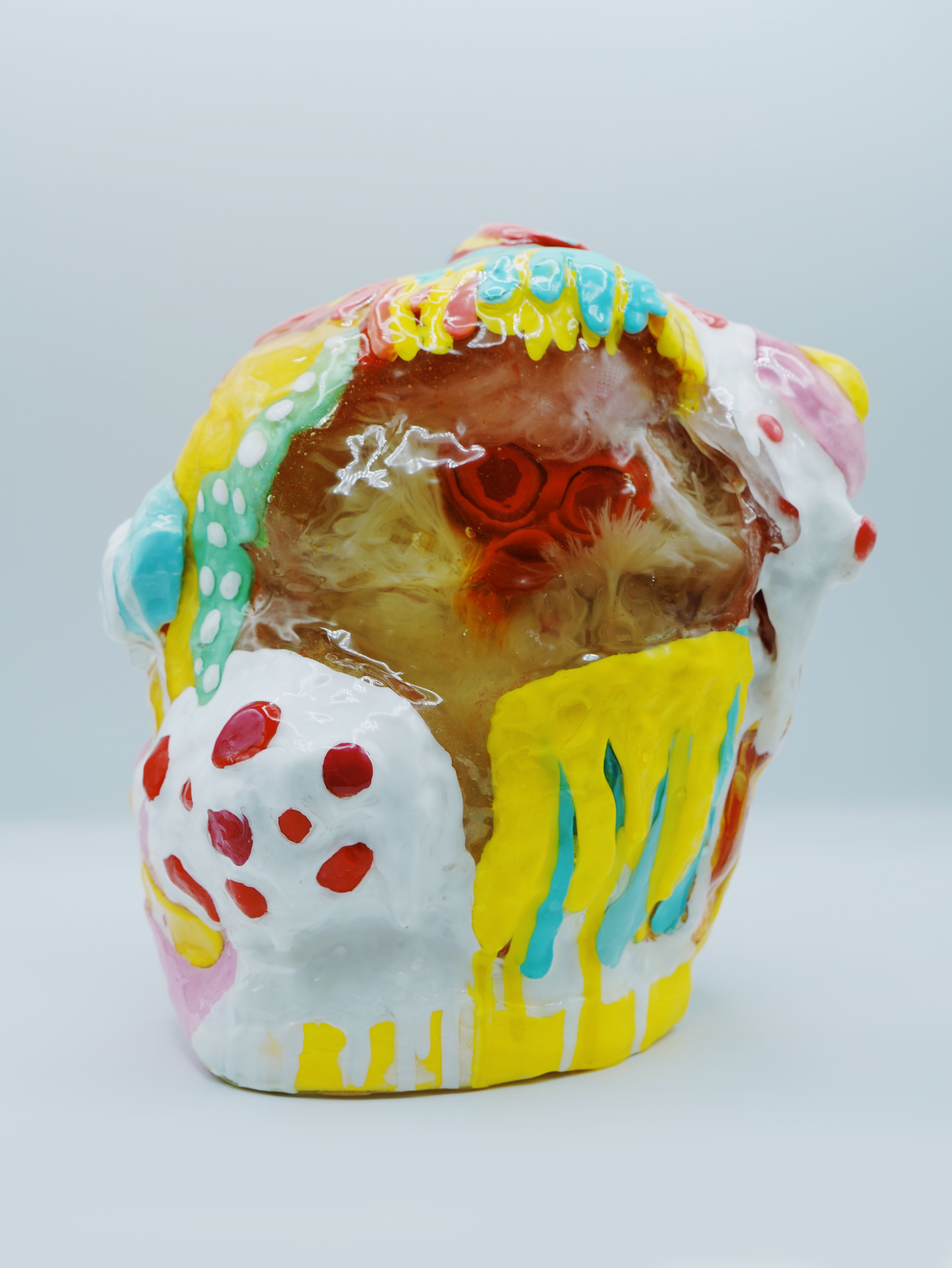 In Happy’s House, artist Sophia Huang encases altered plush figures in resin, foam, and paint to expose how memory distorts emotional truth, transforming familiarity into something fragmented, unreliable, and deceptively preserved.