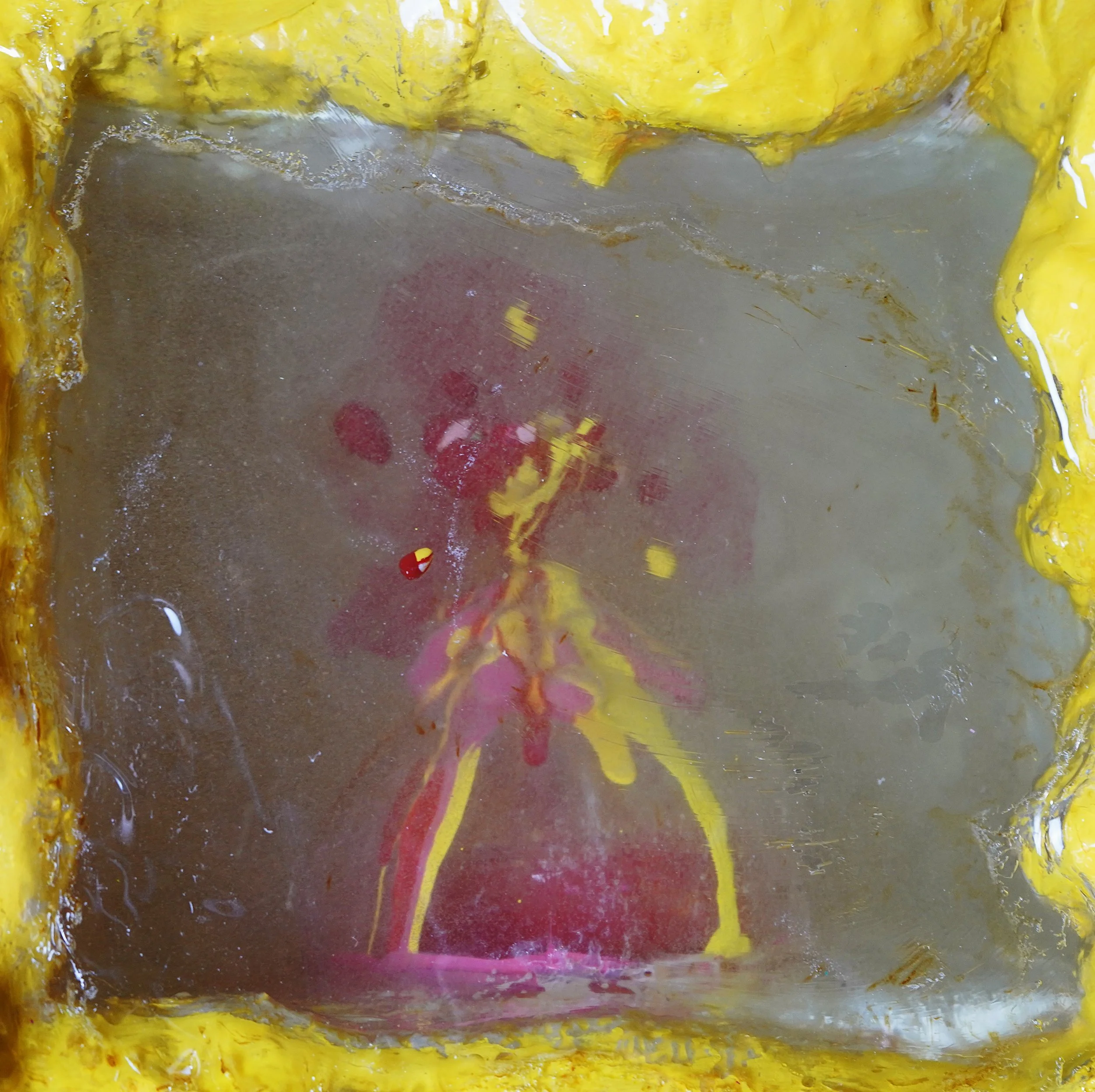 Detail view of Volcanic Shelf sculpture by contemporary artist Sophia Huang, mixed media shelf sculpture with resin, paint, and embedded objects, abstract melting form