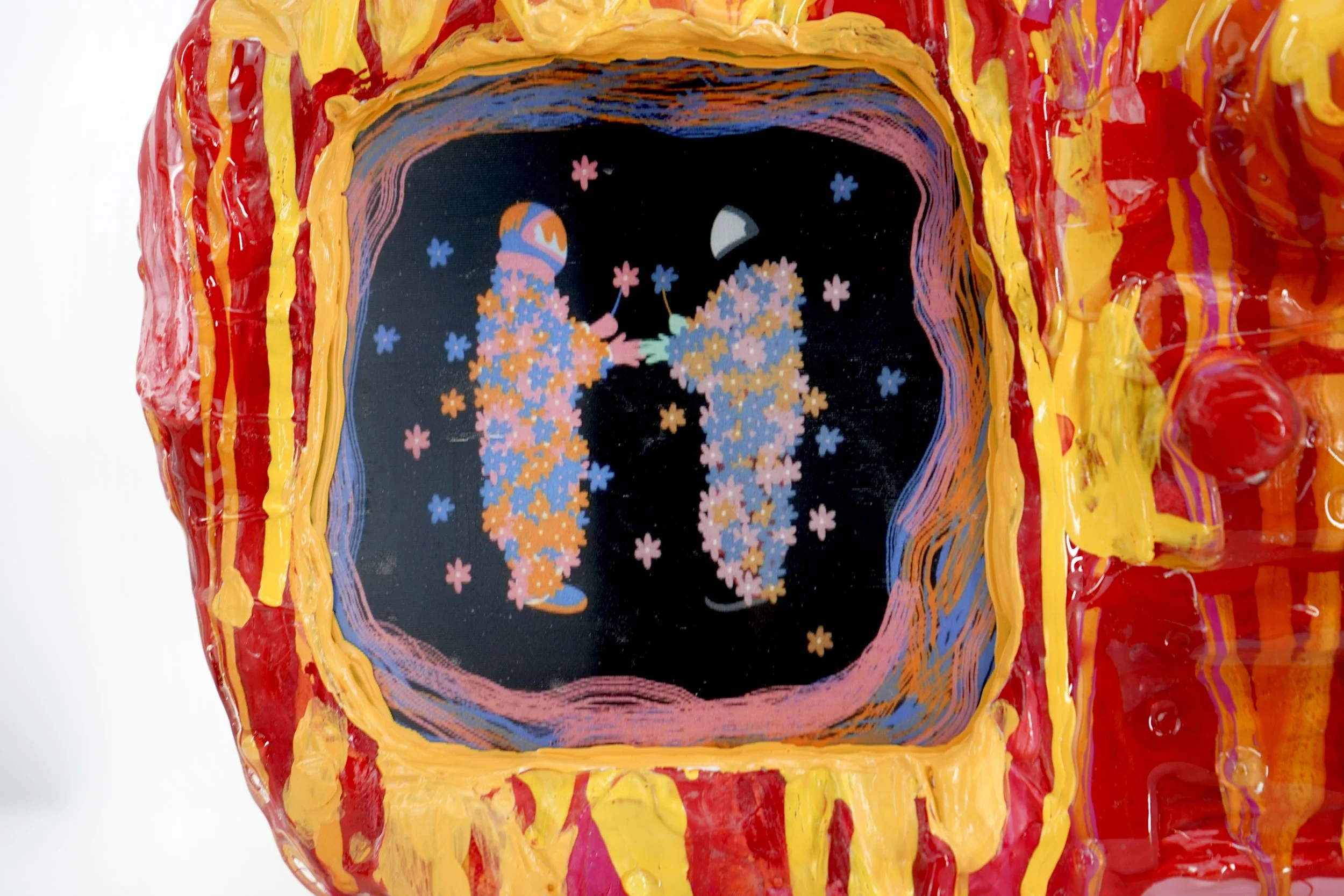 Detail view of melting television sculpture by contemporary artist Sophia Huang, mixed media sculpture with resin, paint, and embedded lenticular print, abstract TV form