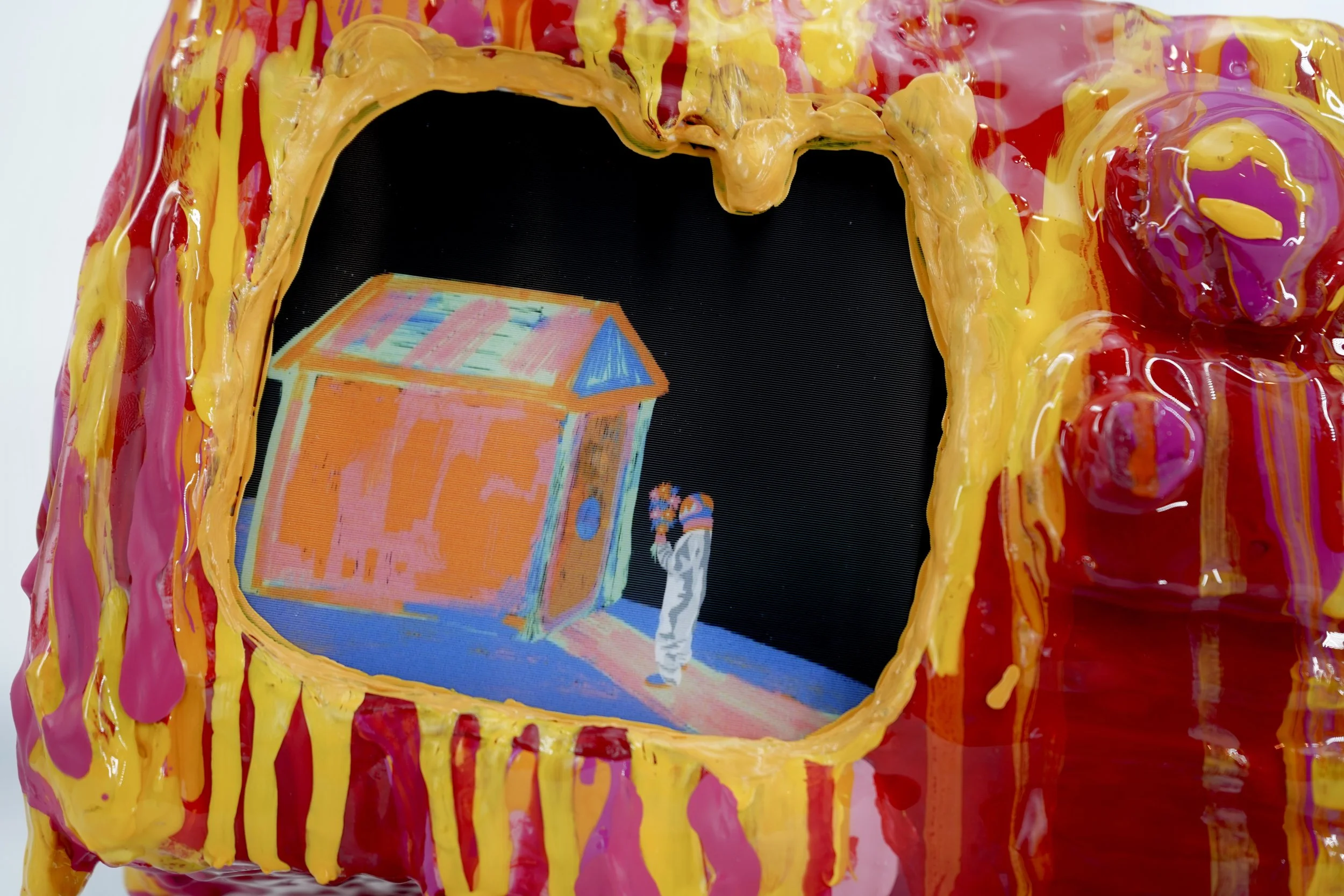 Detail view of melting television sculpture by contemporary artist Sophia Huang, mixed media sculpture with resin, paint, and embedded lenticular print, abstract TV form
