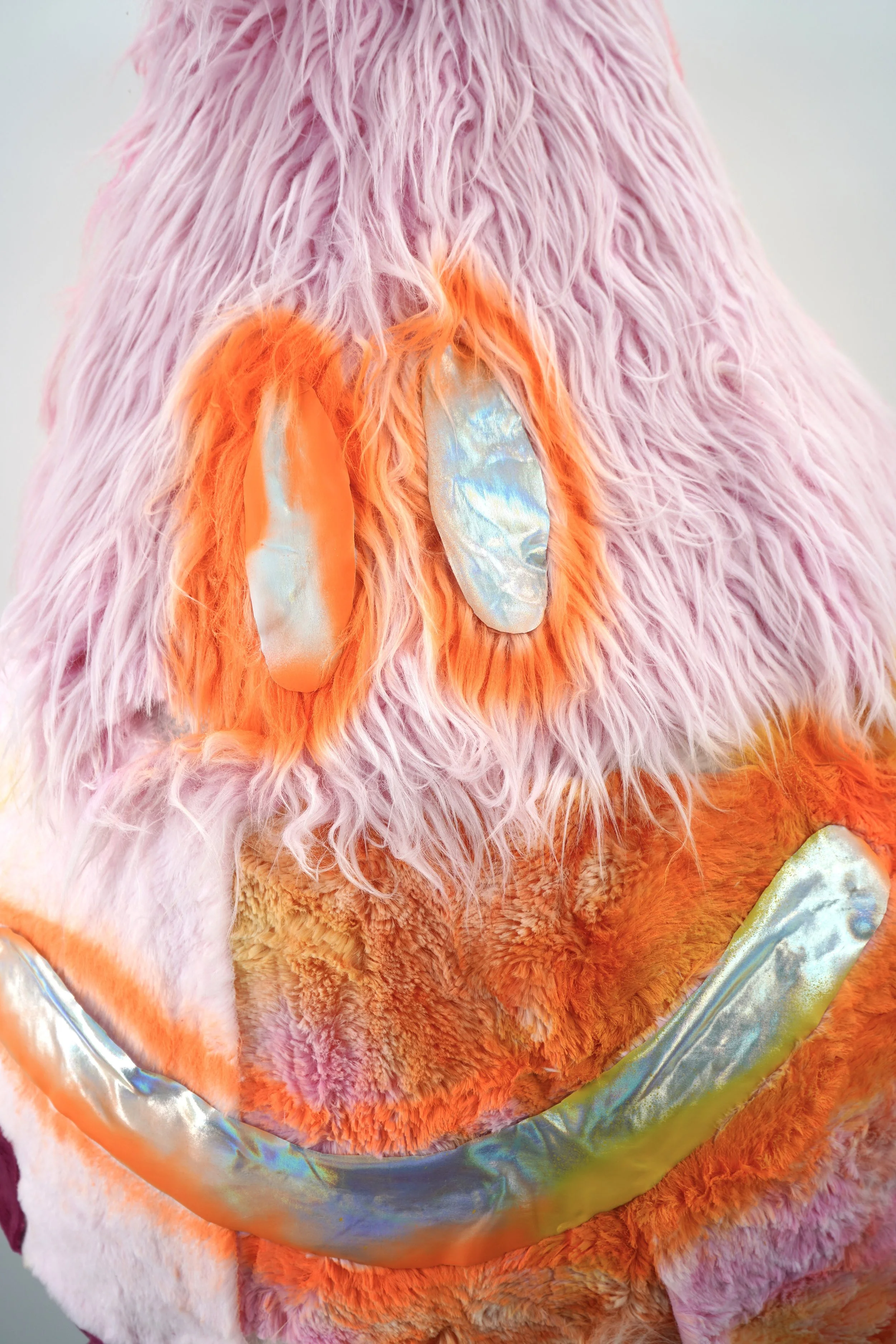 Detail view of The Recovering People Pleaser sculpture by contemporary artist Sophia Huang, mixed media sculpture featuring plush textile surface