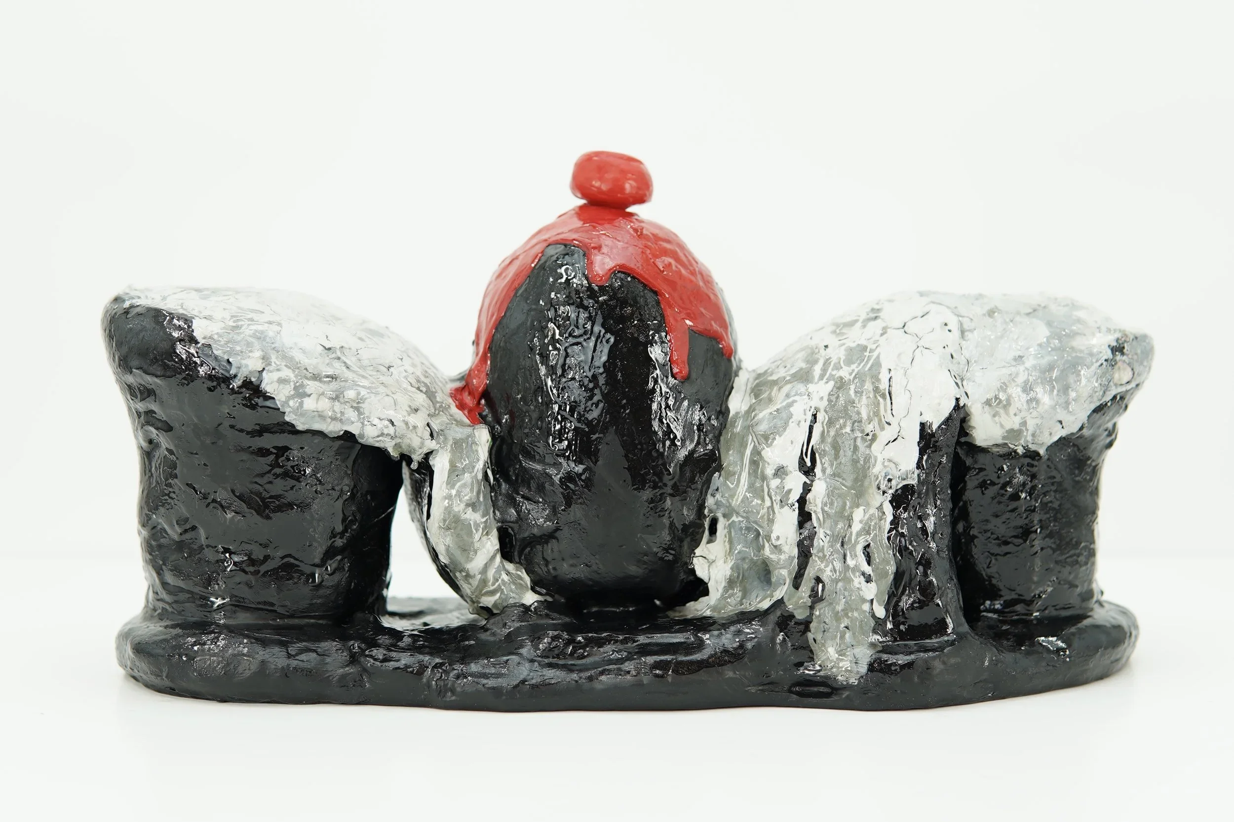 In Ash Banquet, artist Sophia Huang creates abstract resin and clay foam vessels containing the ashes of burned letters to past lovers and former selves, transforming grief into a ritual of containment, closure, and release.