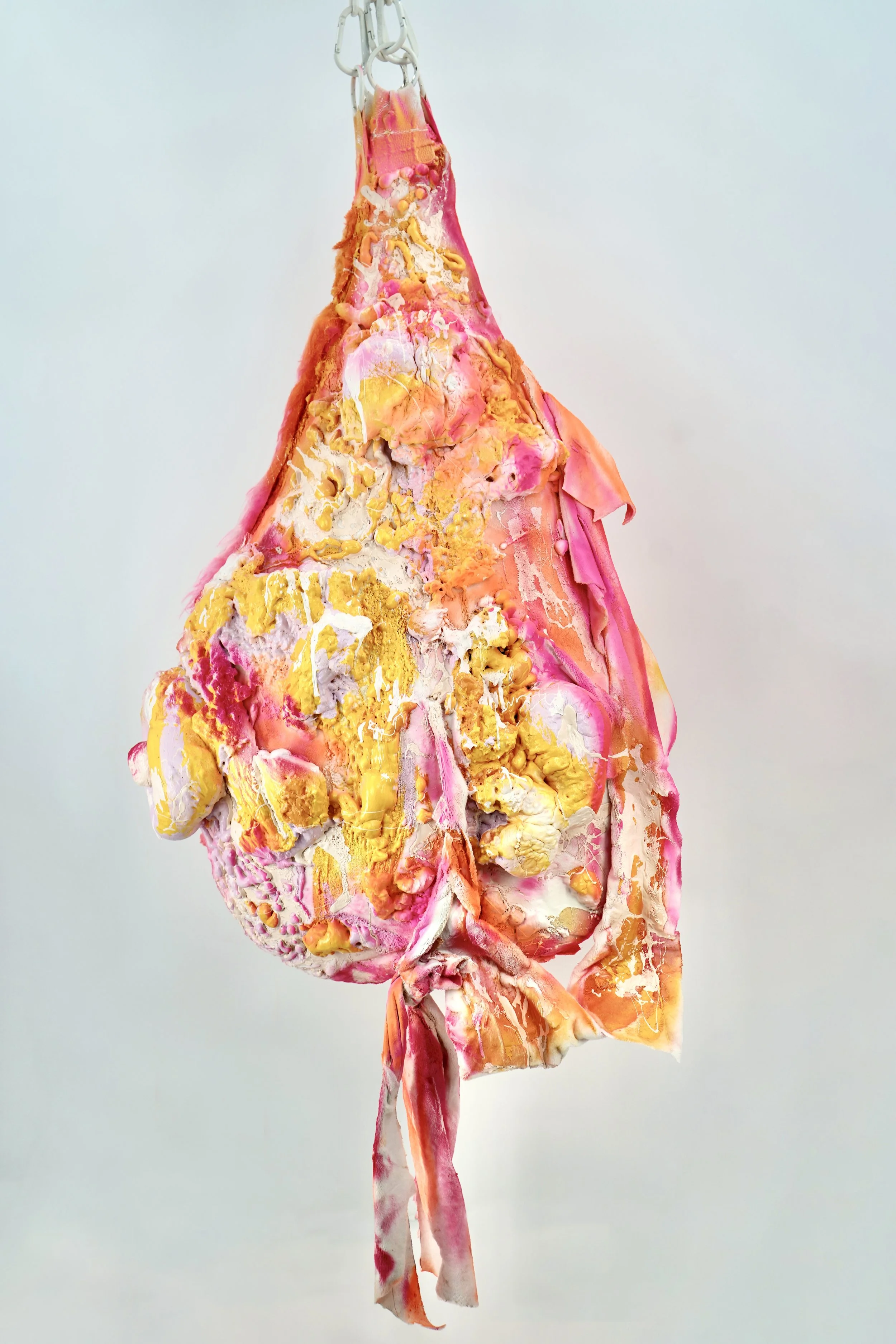 Back view of The Recovering People Pleaser sculpture by contemporary artist Sophia Huang, mixed media sculpture with resin, foam, and textile elements, suspended abstract form