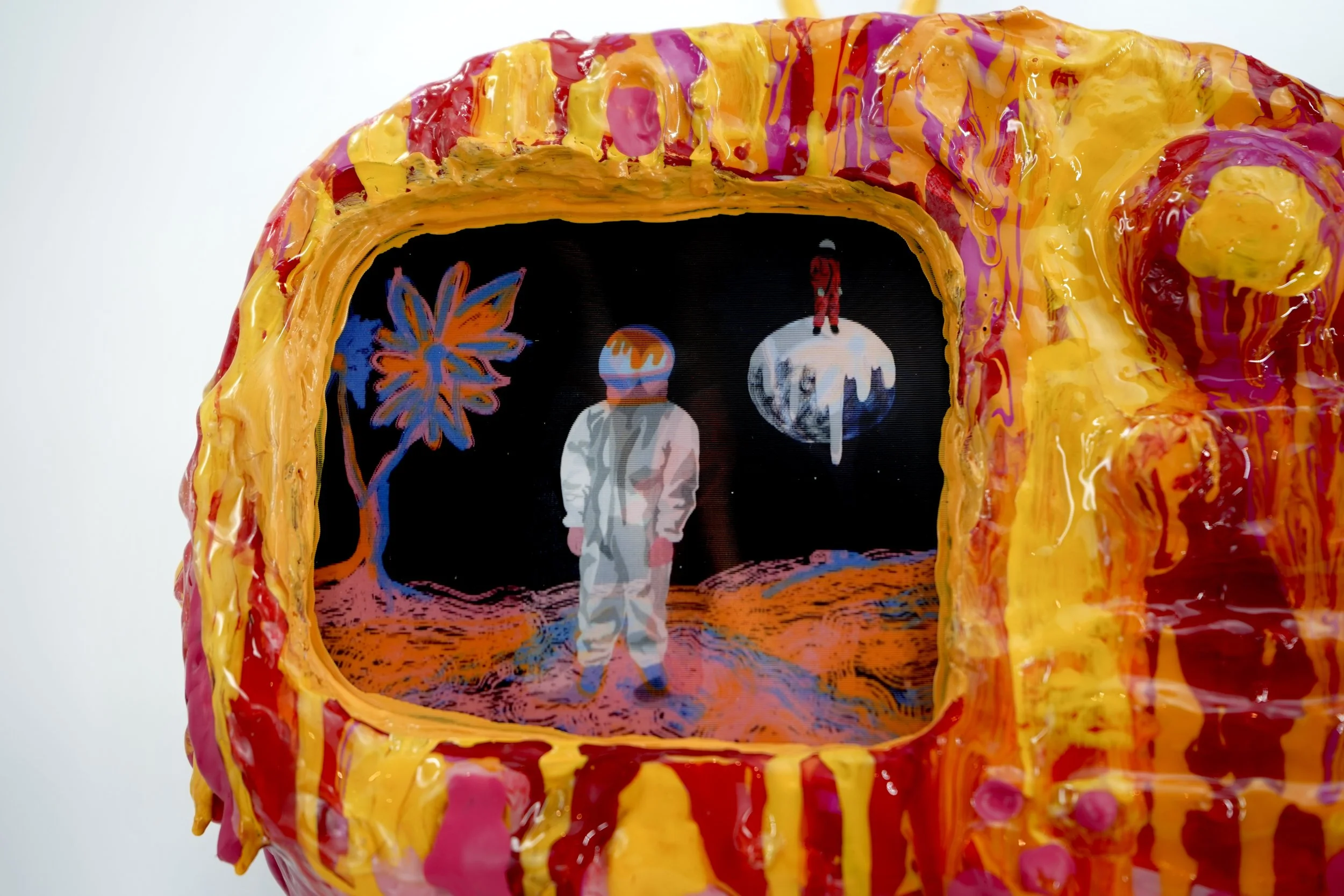 Detail view of melting television sculpture by contemporary artist Sophia Huang, mixed media sculpture with resin, paint, and embedded lenticular print, abstract TV form