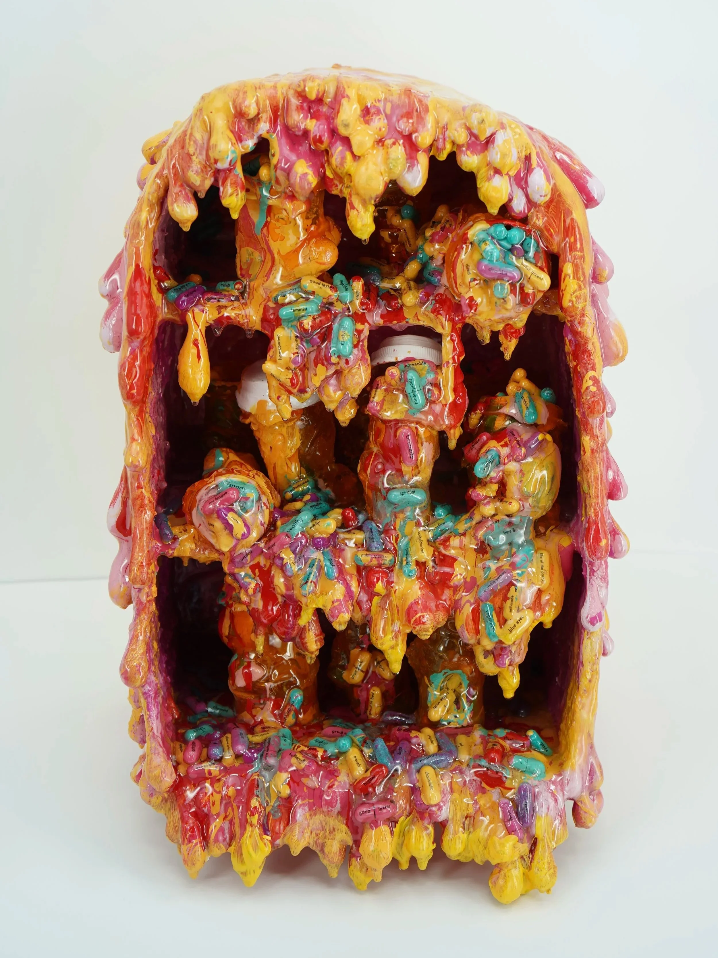 In Pink’s Prescription, artist Sophia Huang presents a melting medicine cabinet of decaying pills to expose the emotional toxicity and false fulfillment of seeking connection through external validation.