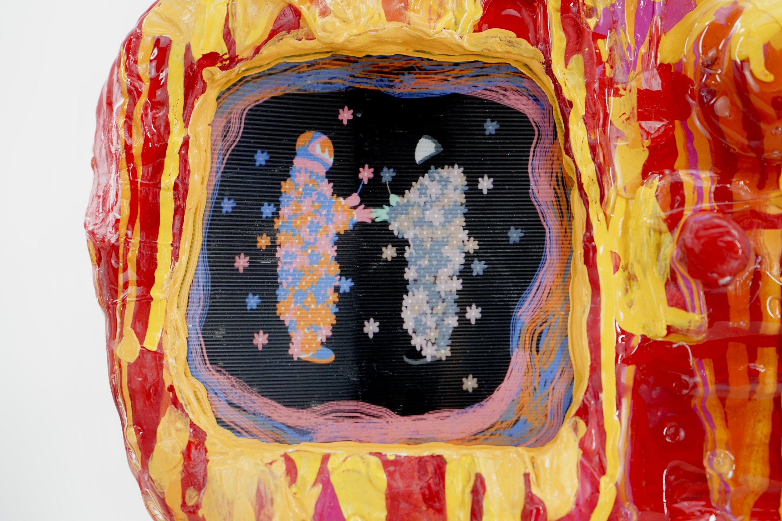 Detail view of melting television sculpture by contemporary artist Sophia Huang, mixed media sculpture with resin, paint, and embedded lenticular print, abstract TV form