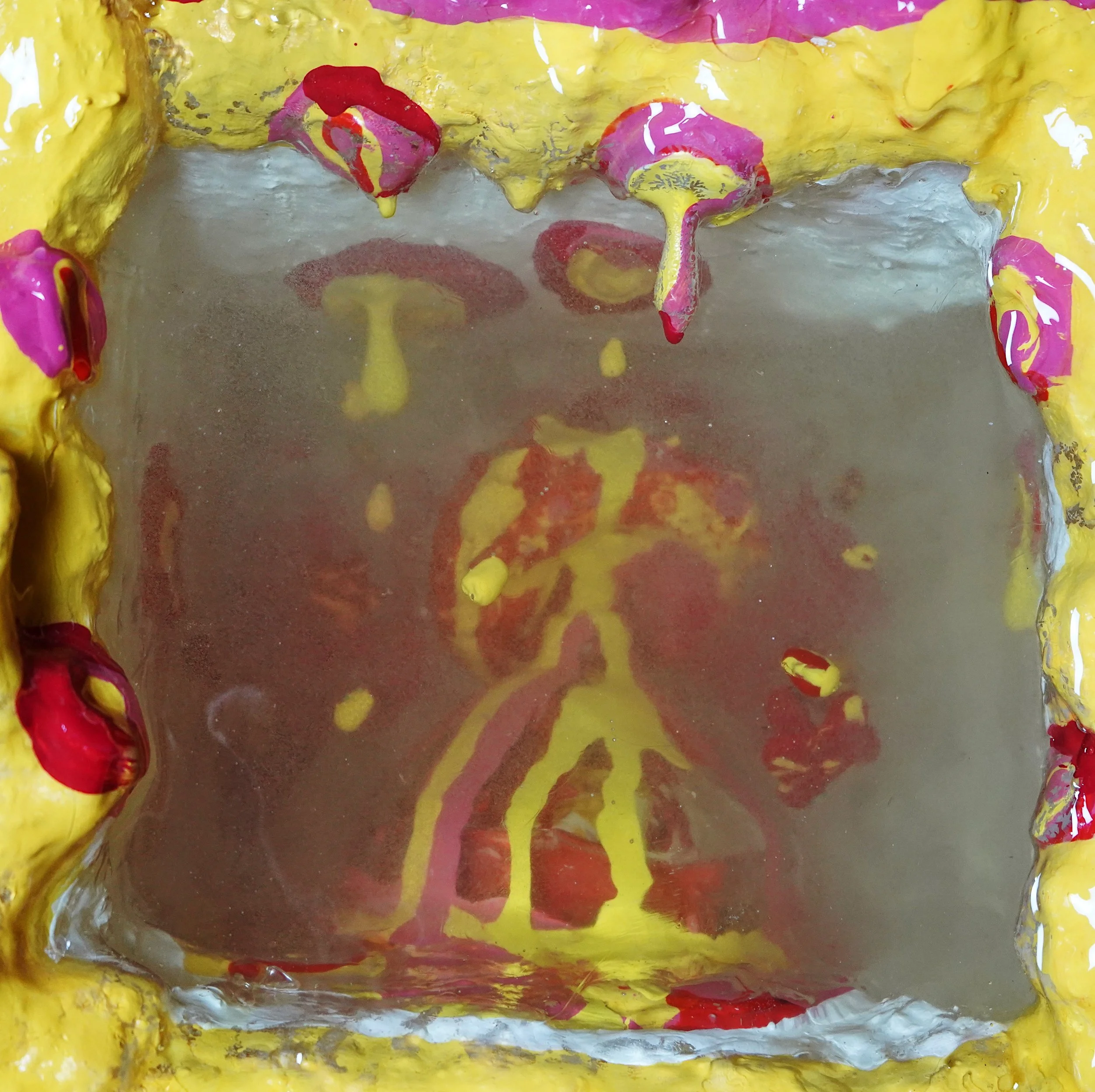 Detail view of Volcanic Shelf sculpture by contemporary artist Sophia Huang, mixed media shelf sculpture with resin, paint, and embedded objects, abstract melting form