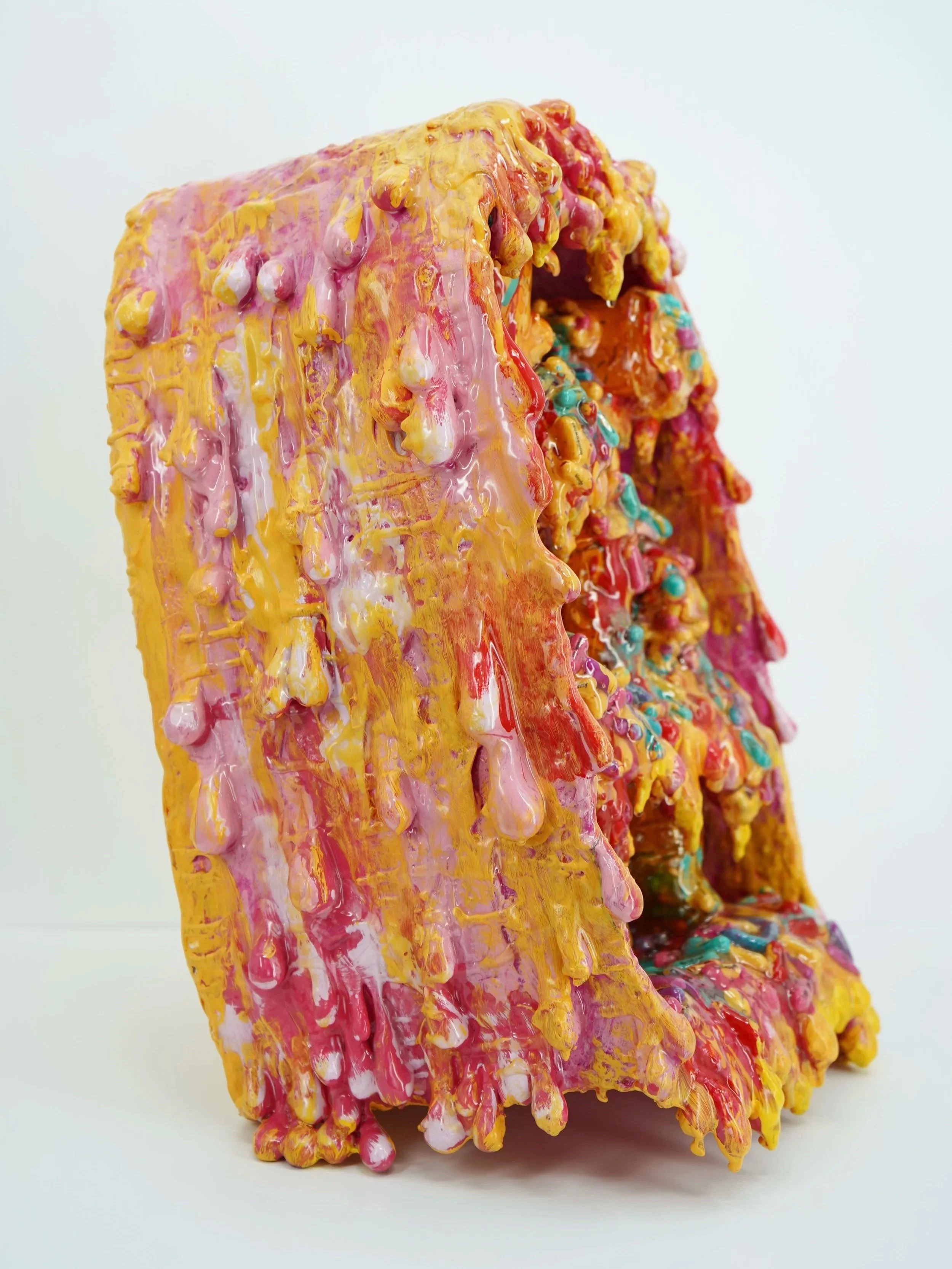 Side view of melting medicine cabinet sculpture by contemporary artist Sophia Huang, mixed media sculpture with resin, paint, and embedded pill capsules