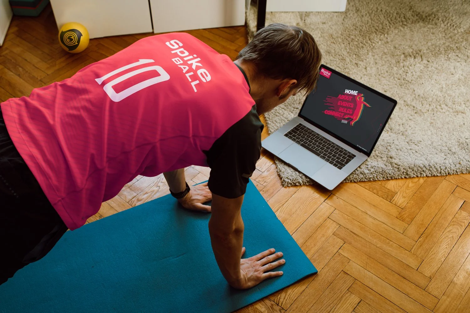 Spikeball Club website and branded shirt in a sports setting