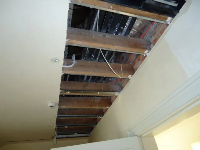Ceiling survey of failed pipework and damp.